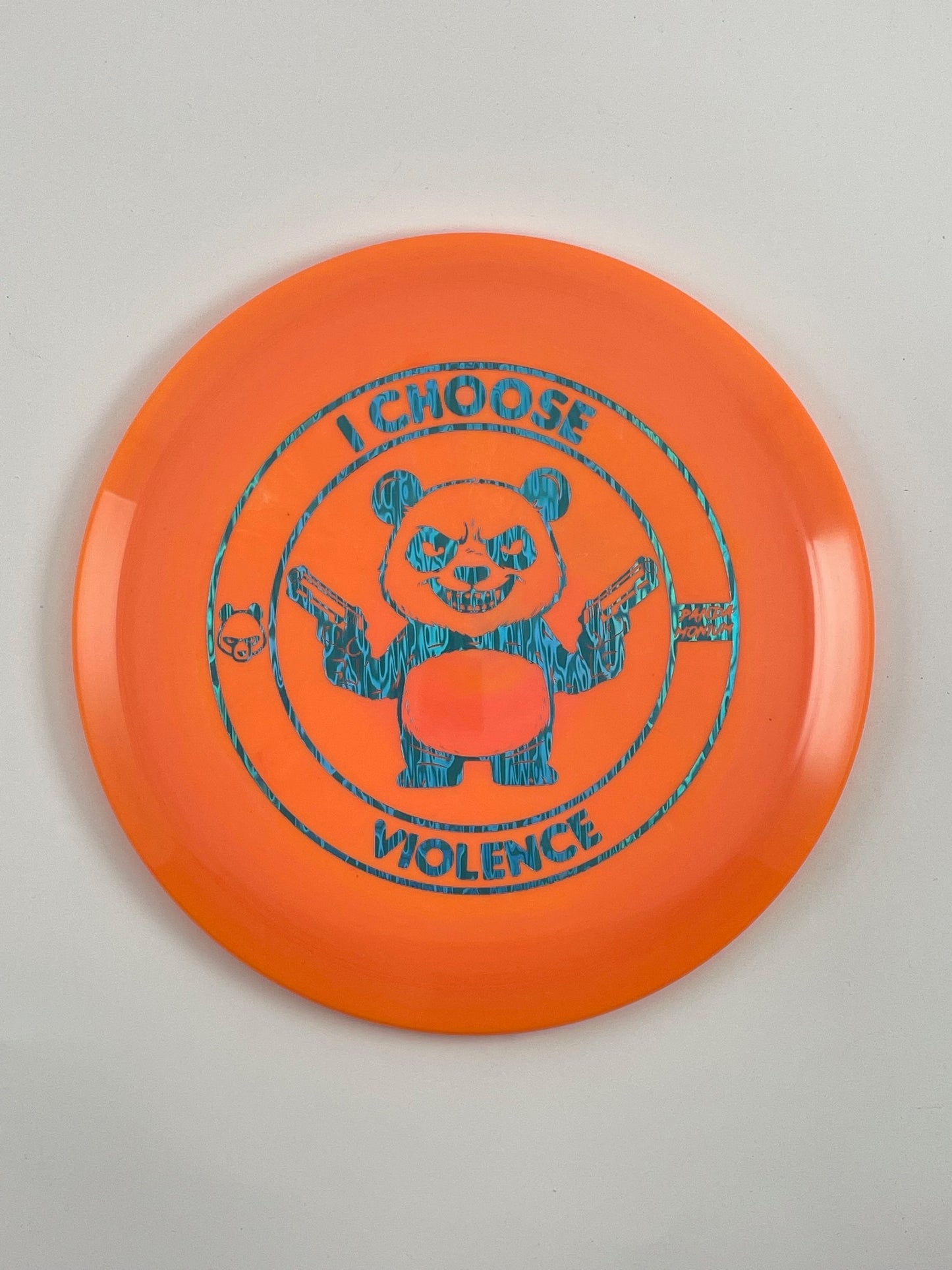 Discraft Cicada disc golf fairway driver in orange ESP plastic with Pandamonium I Choose Violence stamp