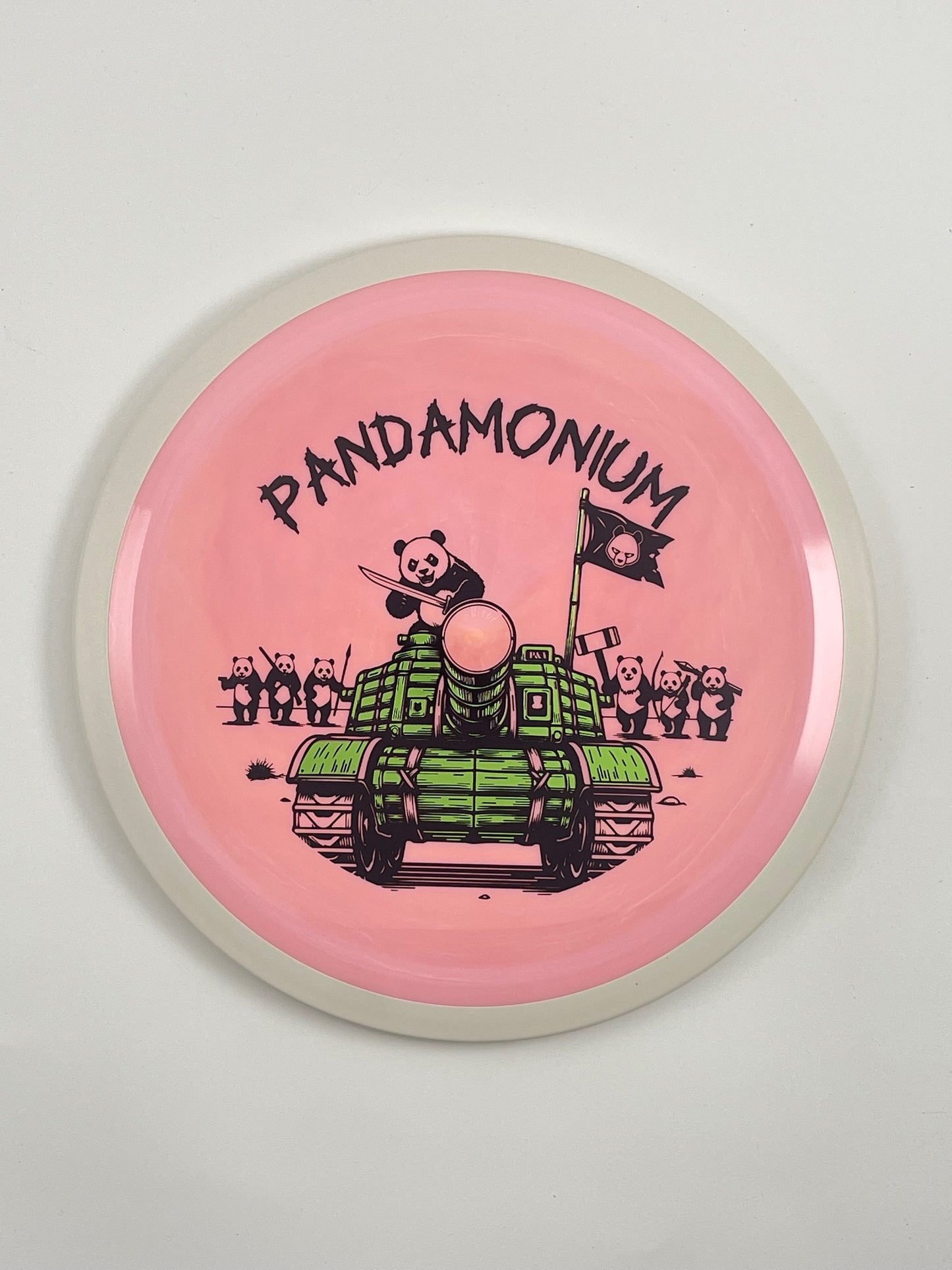 MVP Trail disc golf distance driver in pink Neutron plastic with Pandamonium Panda Tank stamp