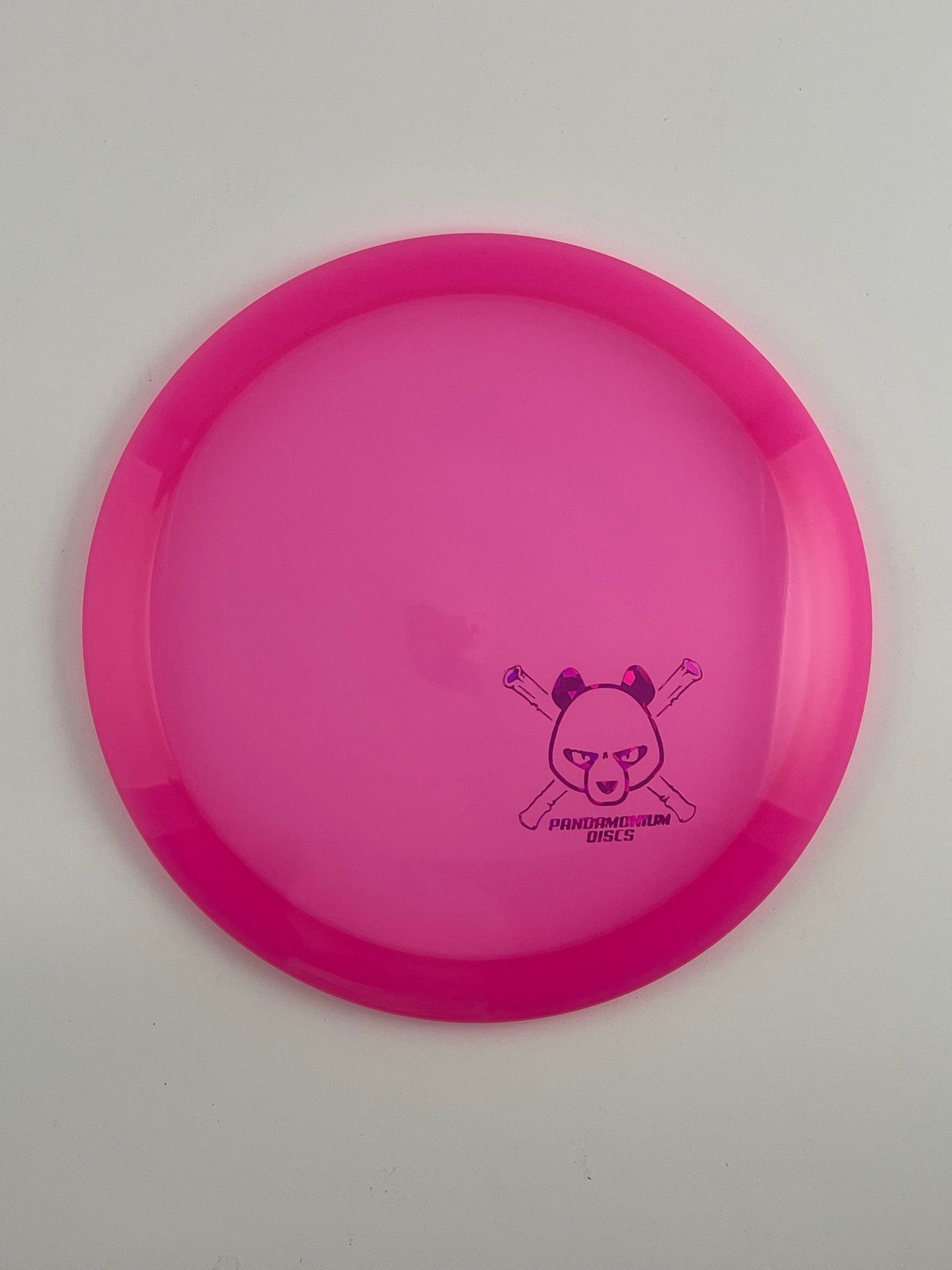 Latitude 64 River disc golf fairway driver in pink Opto plastic with Pandamonium Panda Corner X stamp
