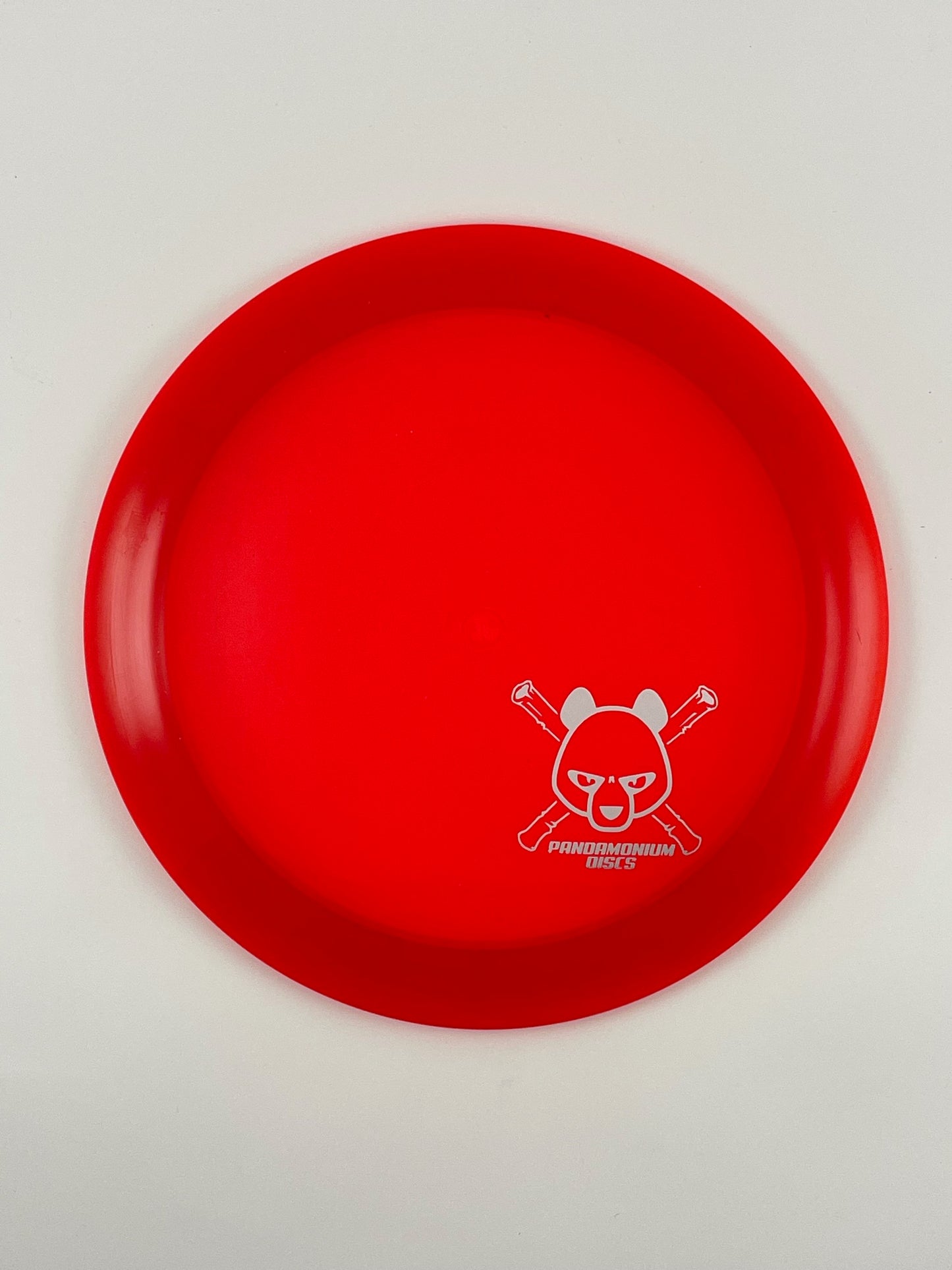 Dynamic Discs Raider disc golf distance driver in red Lucid plastic with Pandamonium Panda Corner X stamp