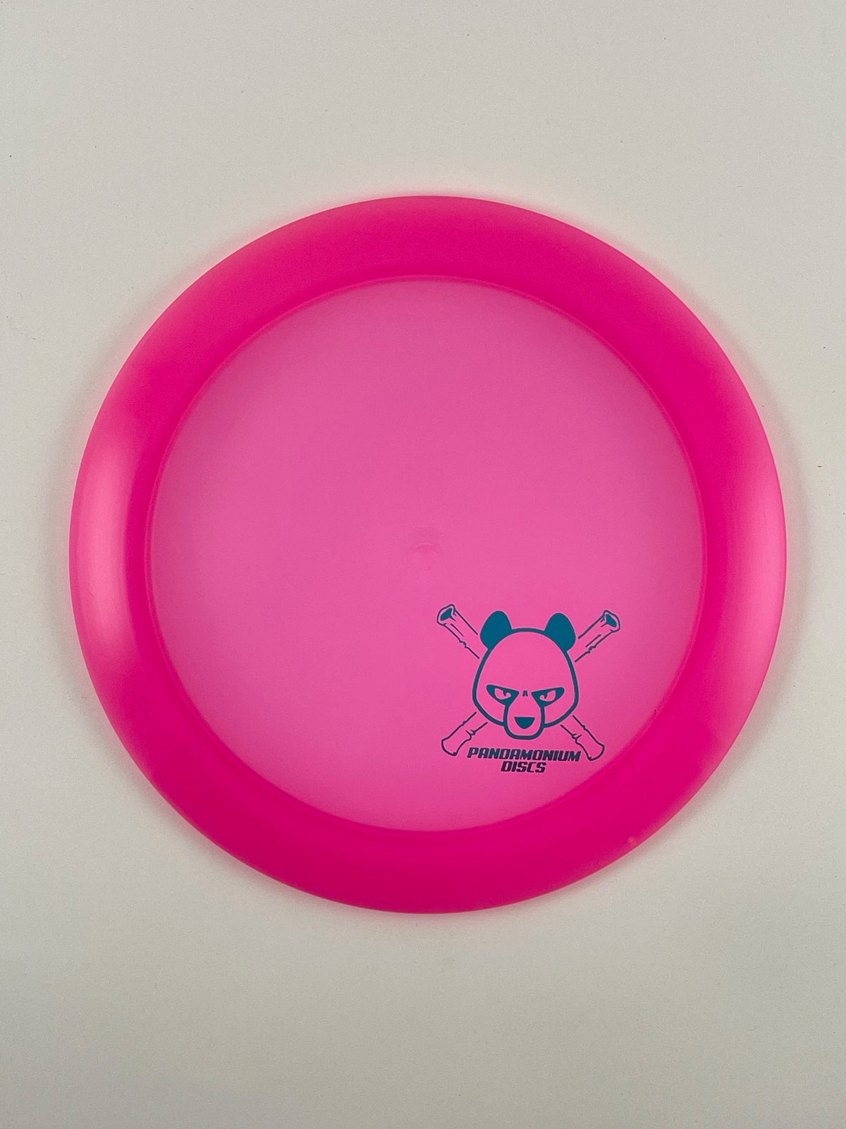 Latitude 64 Ballista Pro disc golf distance driver in pink Opto plastic with Pandamonium Panda Corner X stamp