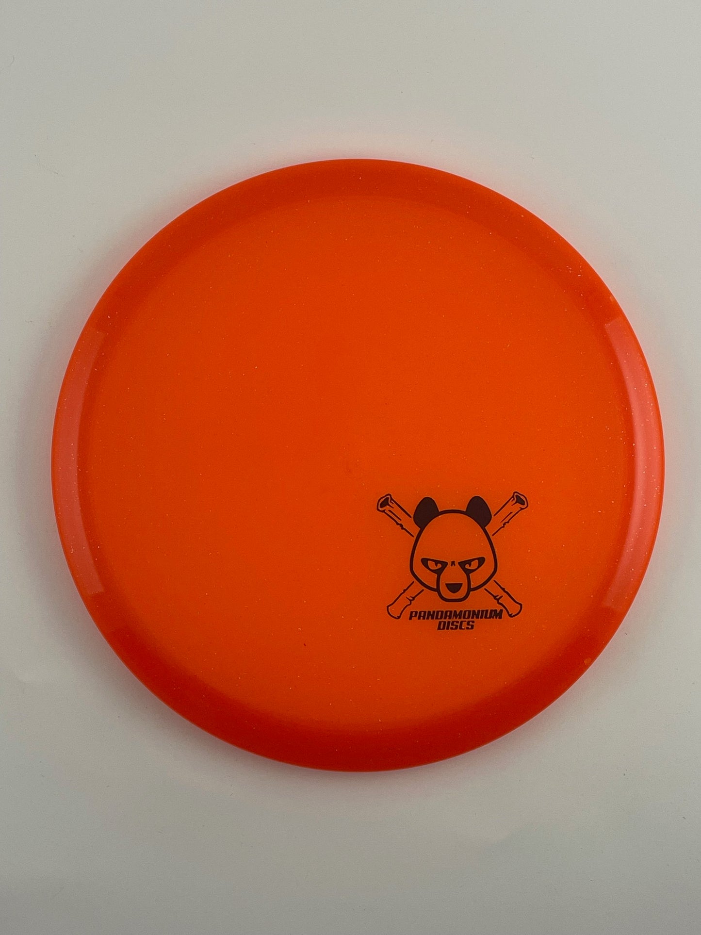 Discmania MD3 disc golf midrange in orange C-Line Metal Flake plastic with Pandamonium Panda Corner X stamp