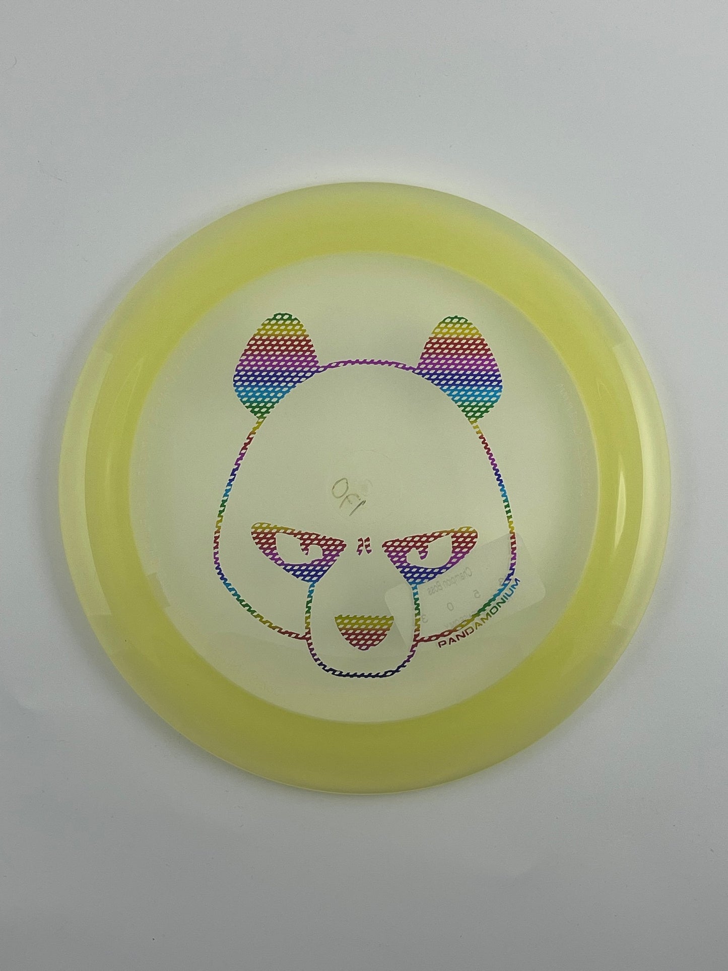 Innova Boss disc golf distance driver in clear and yellow Champion plastic with Pandamonium Big Panda stamp