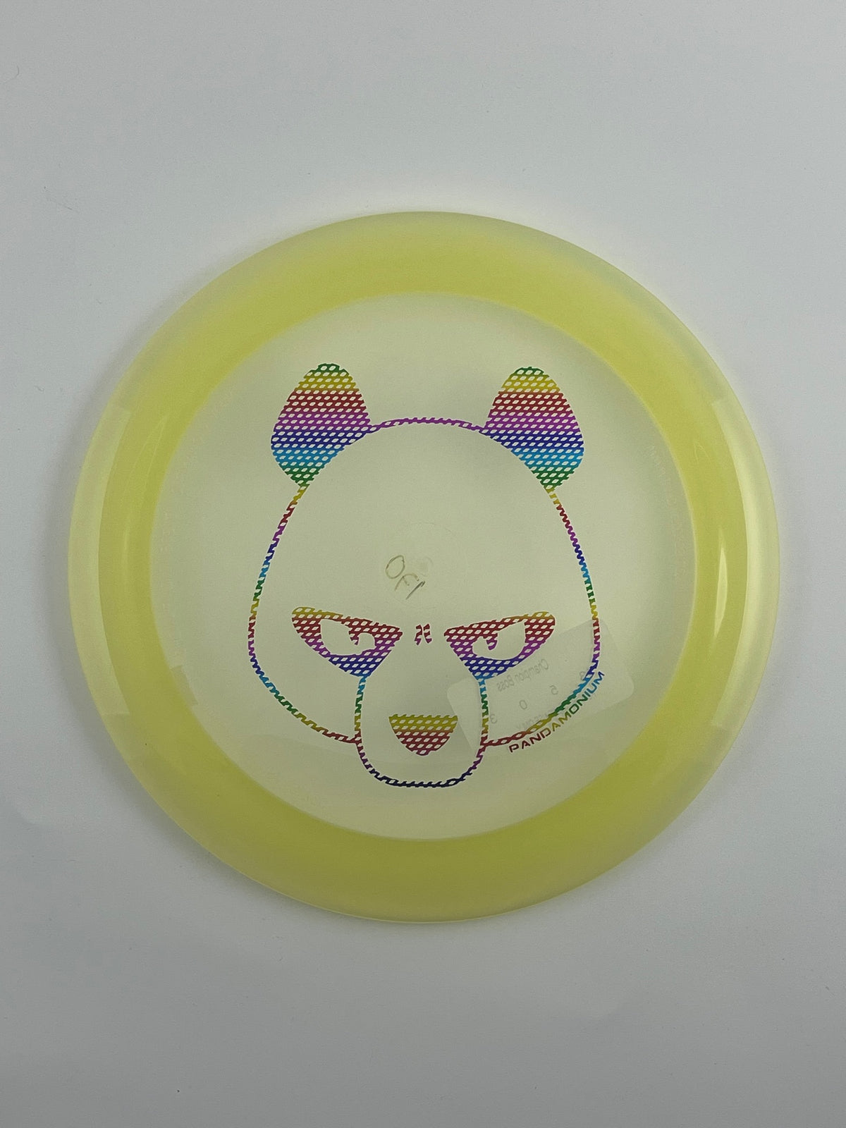 Innova Boss disc golf distance driver in clear and yellow Champion plastic with Pandamonium Big Panda stamp