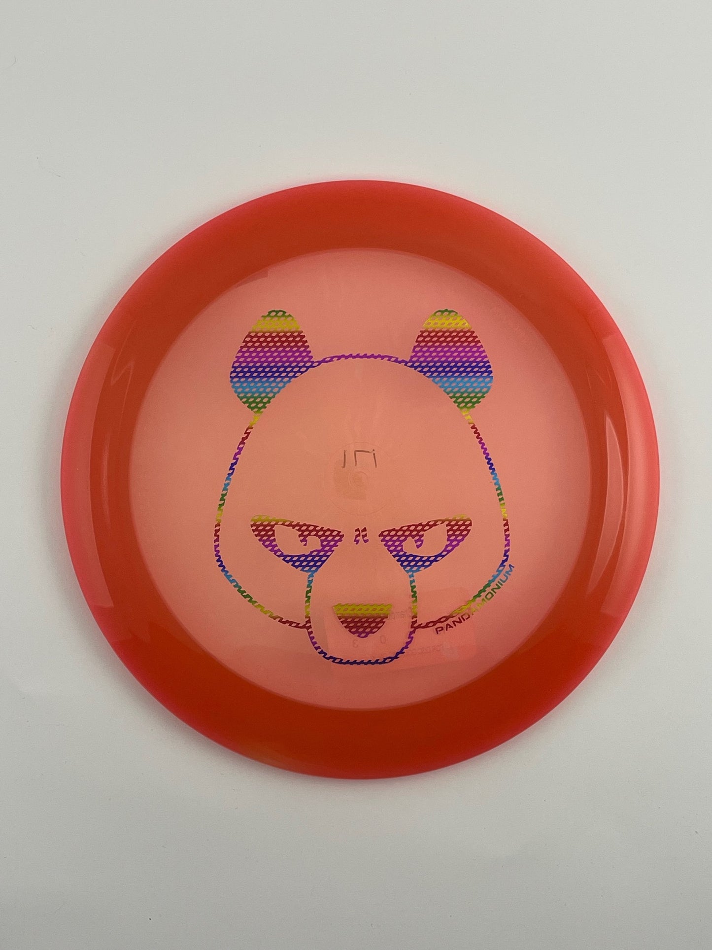 Innova Boss disc golf distance driver in red and orange Champion plastic with Pandamonium Big Panda stamp