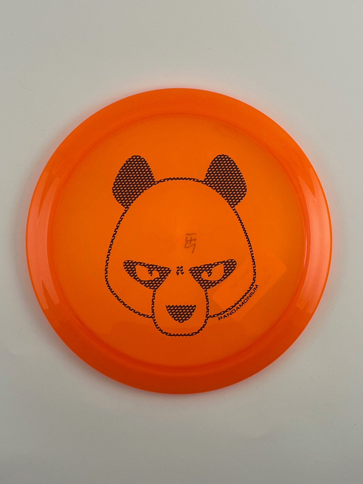 Innova Firebird disc golf fairway driver in orange Champion plastic with Pandamonium Big Panda stamp
