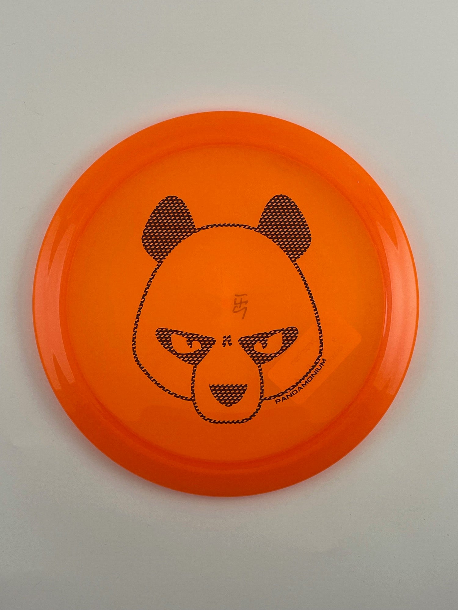 Innova Firebird disc golf fairway driver in orange Champion plastic with Pandamonium Big Panda stamp