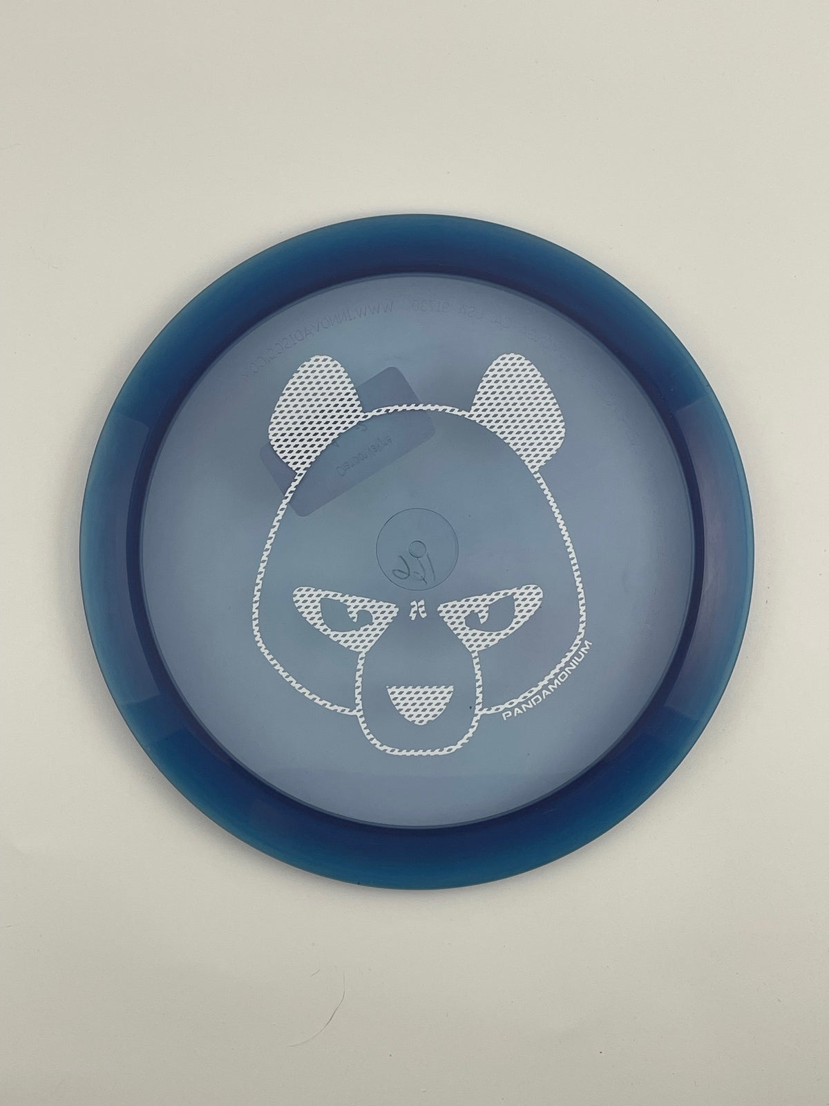 Innova Valkyrie disc golf fairway driver in clear and navy Champion plastic with Pandamonium Big Panda stamp