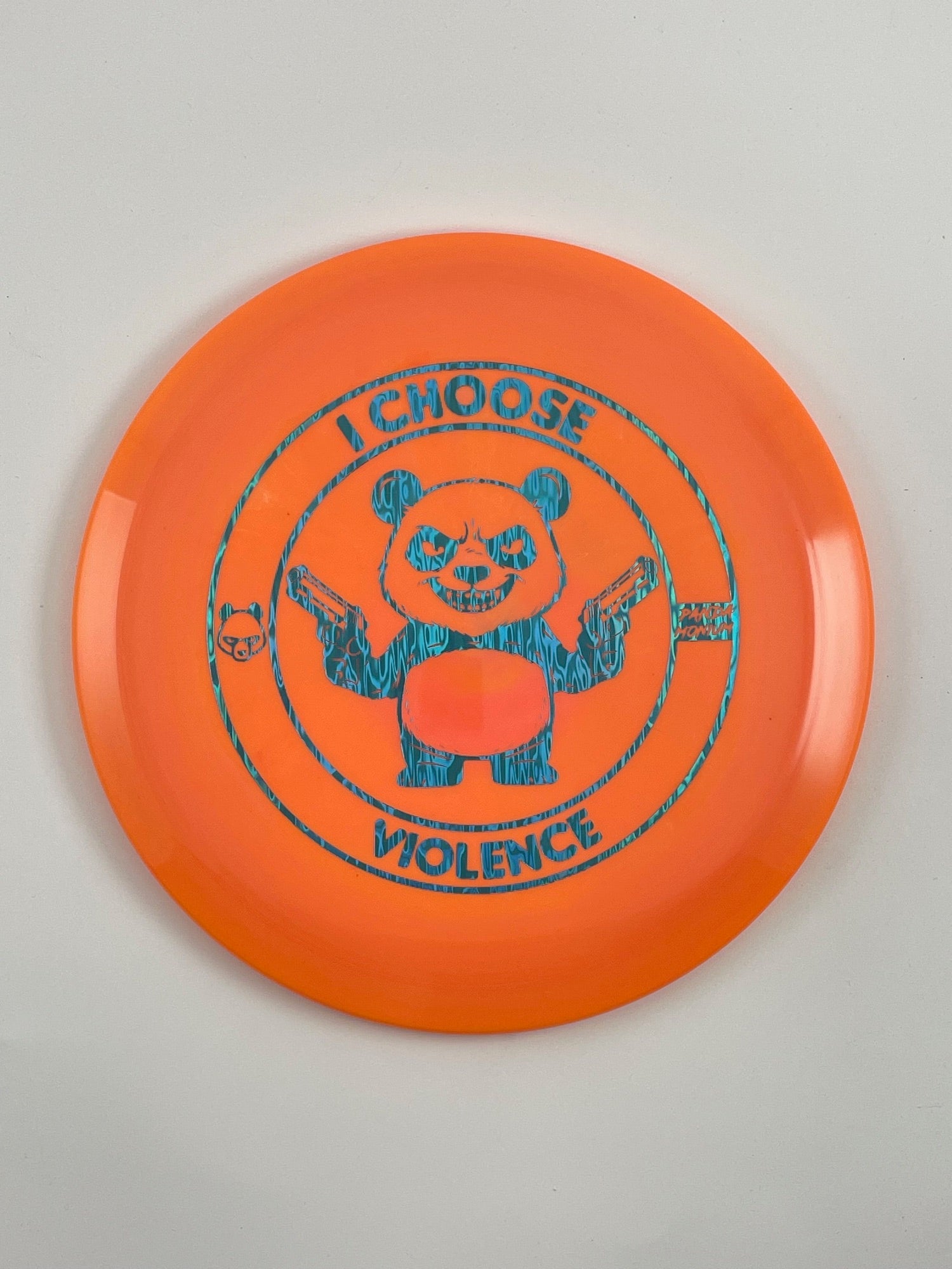 Discraft Cicada disc golf fairway driver in orange ESP plastic with Pandamonium I Choose Violence stamp