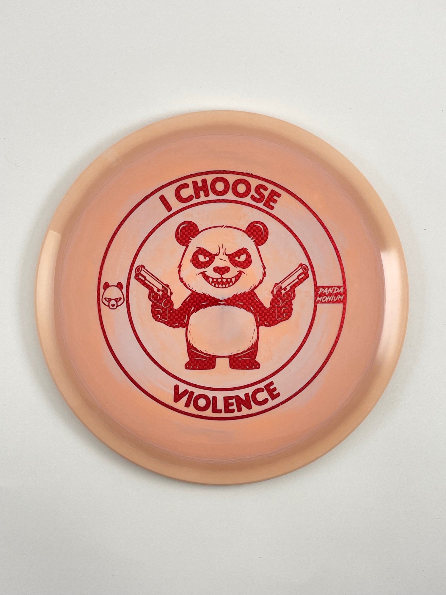 Discraft Cigarra disc golf fairway driver in peach ESP plastic with Pandamonium I Choose Violence stamp