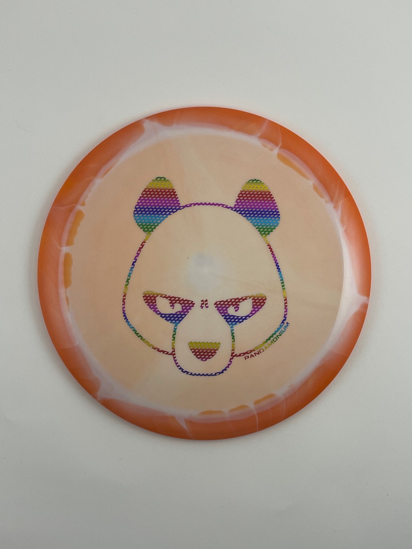 Innova Mamba disc golf distance driver in orange and peach Halo Star plastic with Pandamonium Big Panda stamp