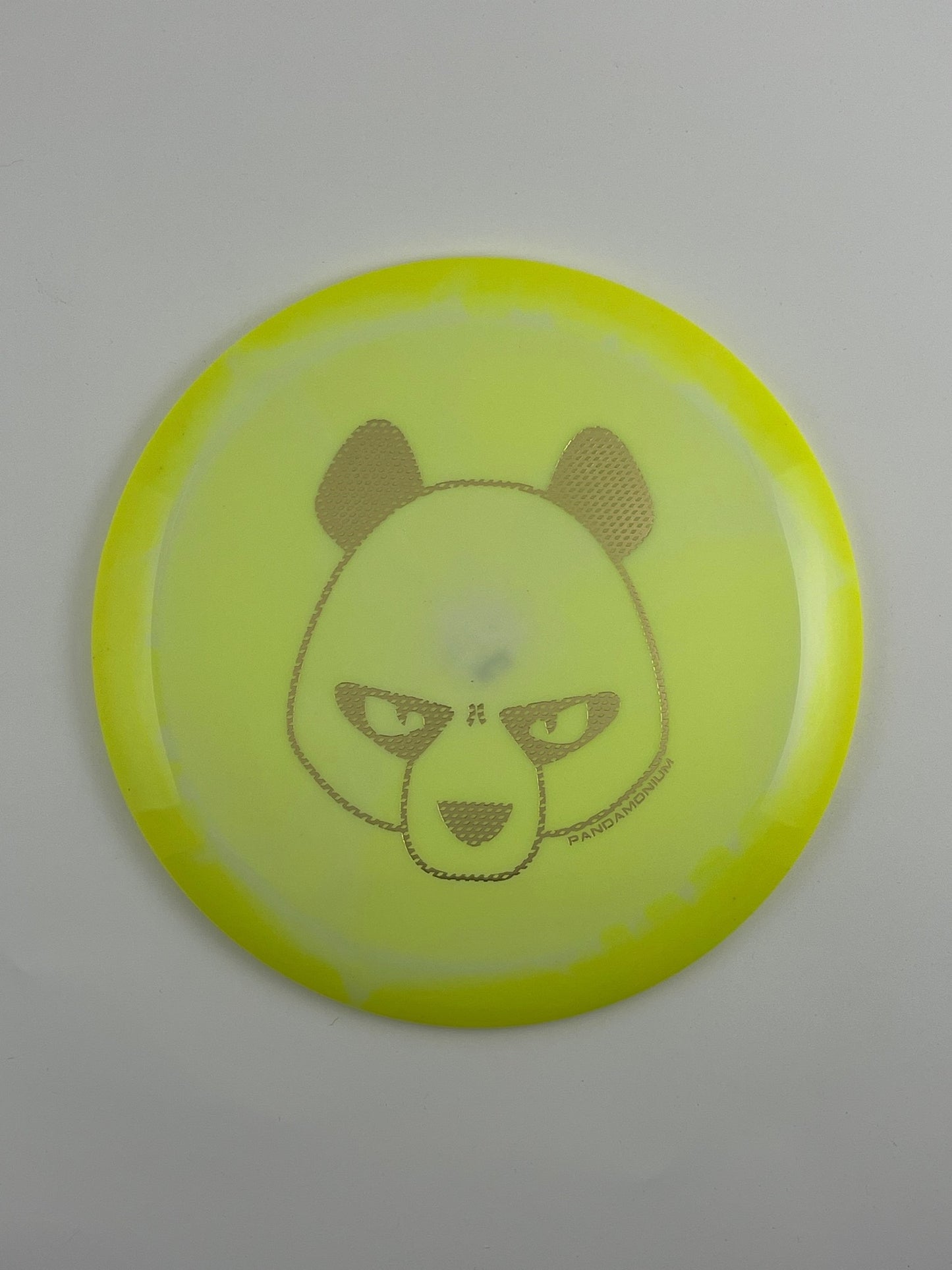 Innova Mamba disc golf distance driver in yellow and light yellow Halo Star plastic with Pandamonium Big Panda stamp