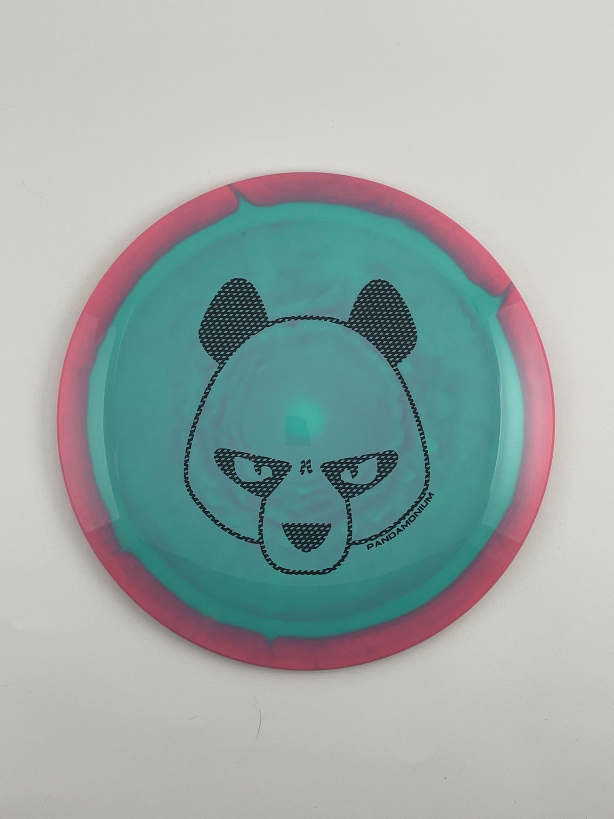 Innova Shryke disc golf distance driver in pink and teal Halo Star plastic with Pandamonium Big Panda stamp