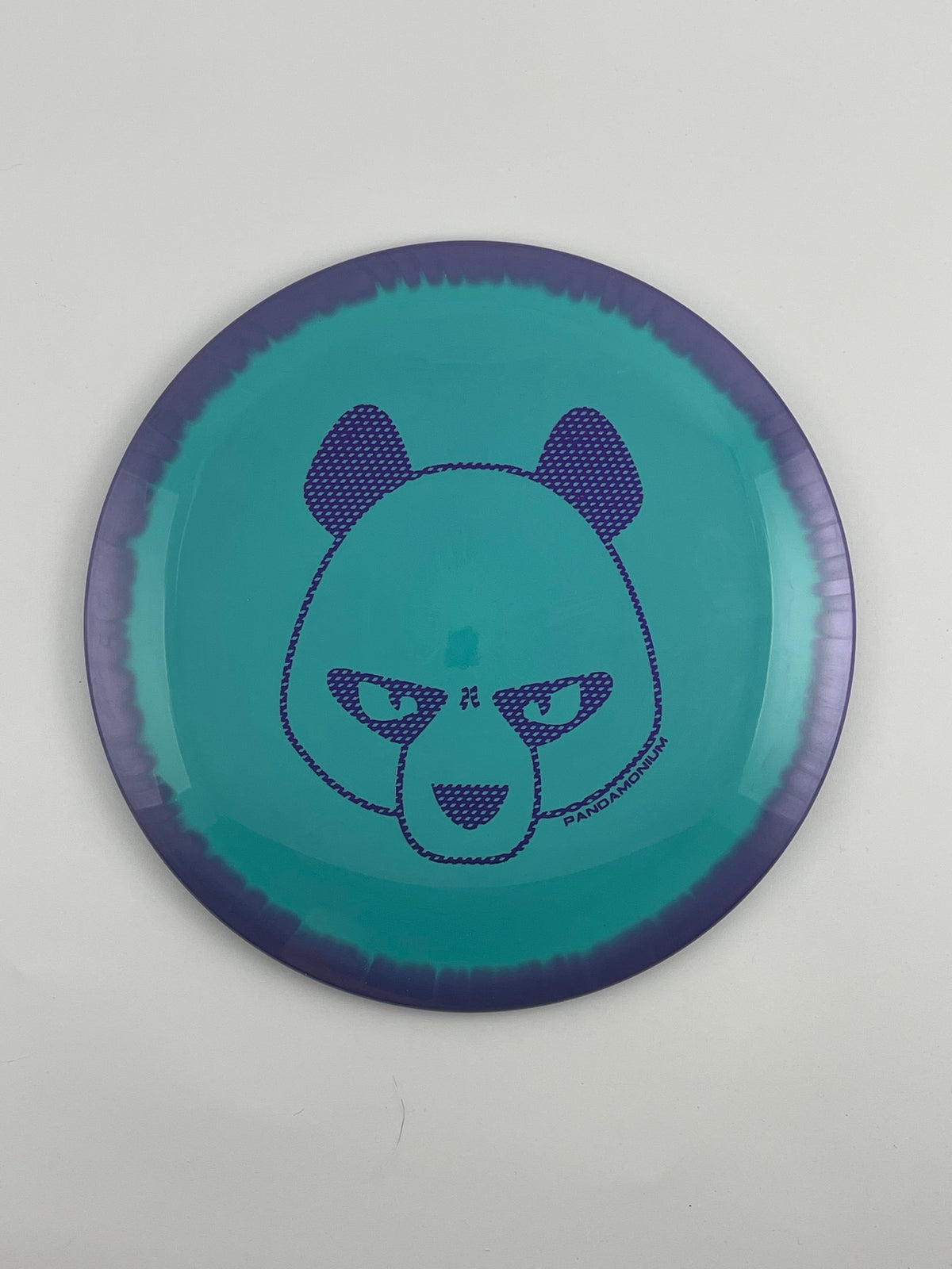 Innova Shryke disc golf distance driver in purple and teal Halo Star plastic with Pandamonium Big Panda stamp
