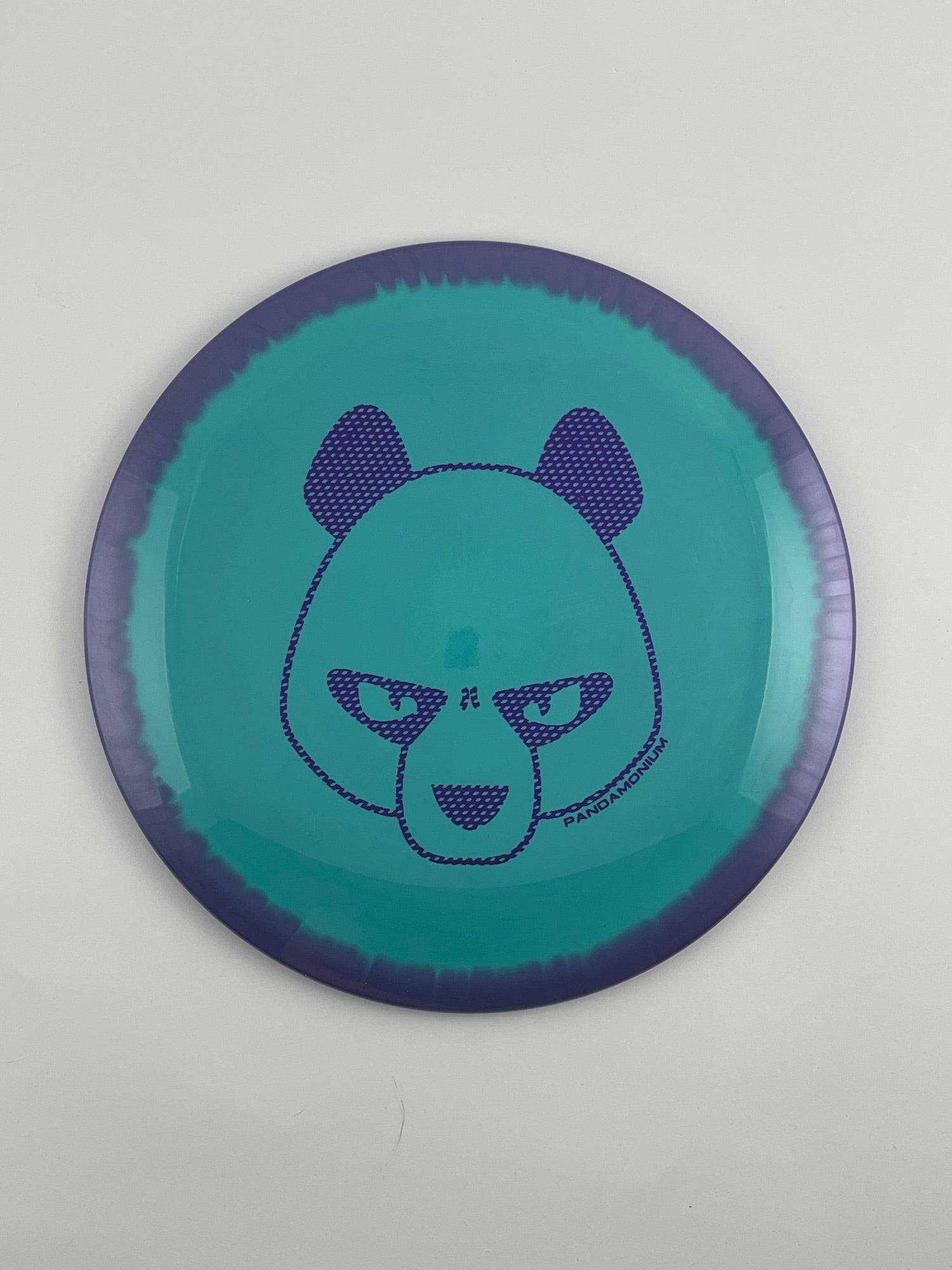 Innova Shryke disc golf distance driver in purple and teal Halo Star plastic with Pandamonium Big Panda stamp