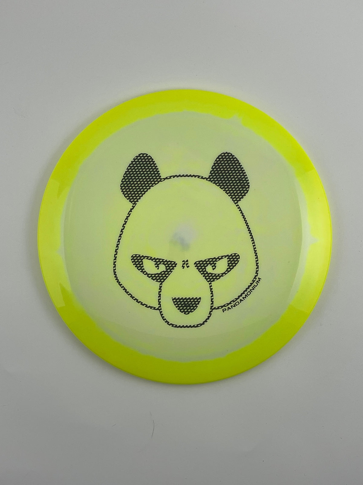 Innova Shryke disc golf distance driver in yellow and light yellow Halo Star plastic with Pandamonium Big Panda stamp