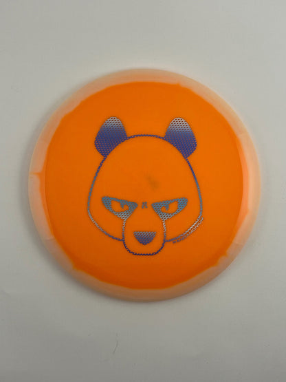 Innova Valkyrie disc golf fairway driver in cream and orange Halo Star plastic with Pandamonium Big Panda stamp