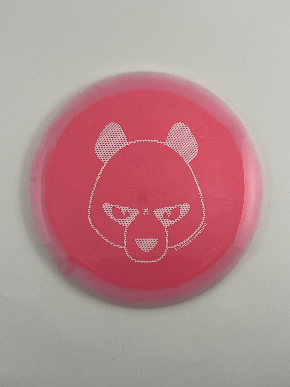 Innova Wraith disc golf distance driver in light pink Halo Star plastic with Pandamonium Big Panda stamp