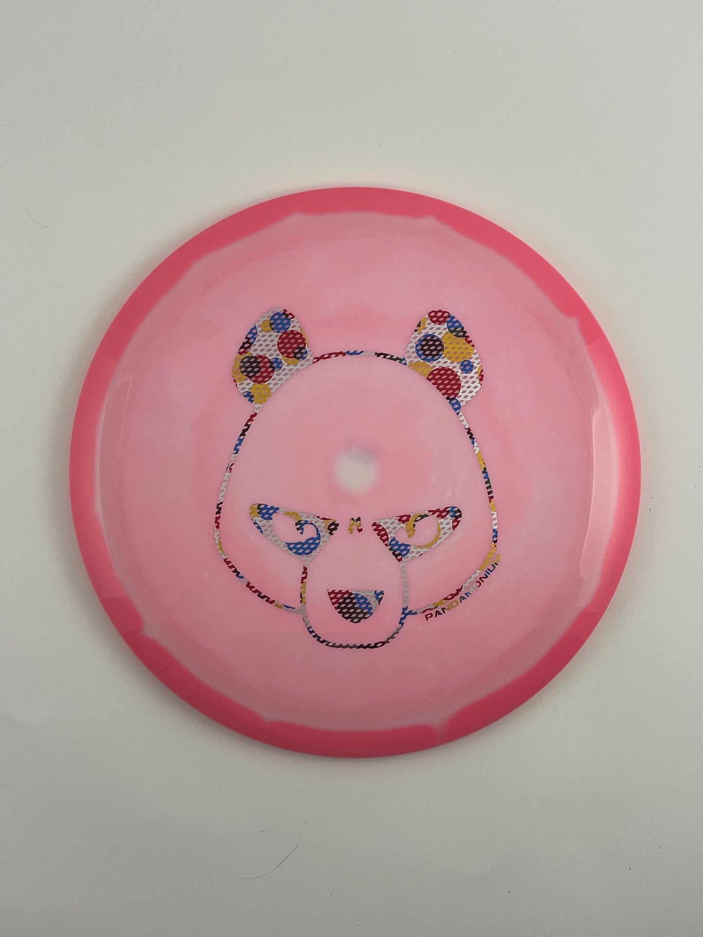 Innova Wraith disc golf distance driver in pink and light pink Halo Star plastic with Pandamonium Big Panda stamp