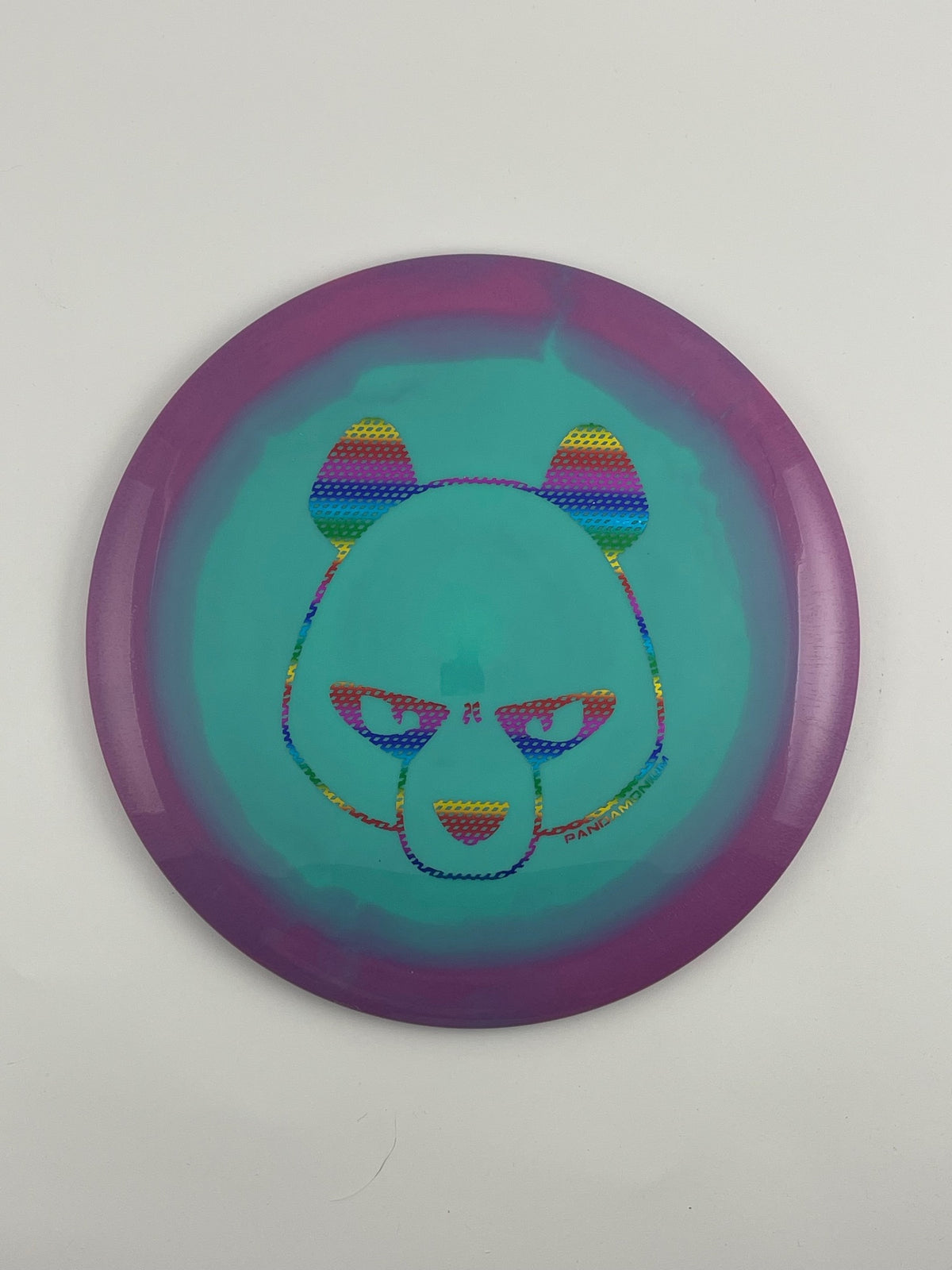 Innova Wraith disc golf distance driver in purple and teal Halo Star plastic with Pandamonium Big Panda stamp