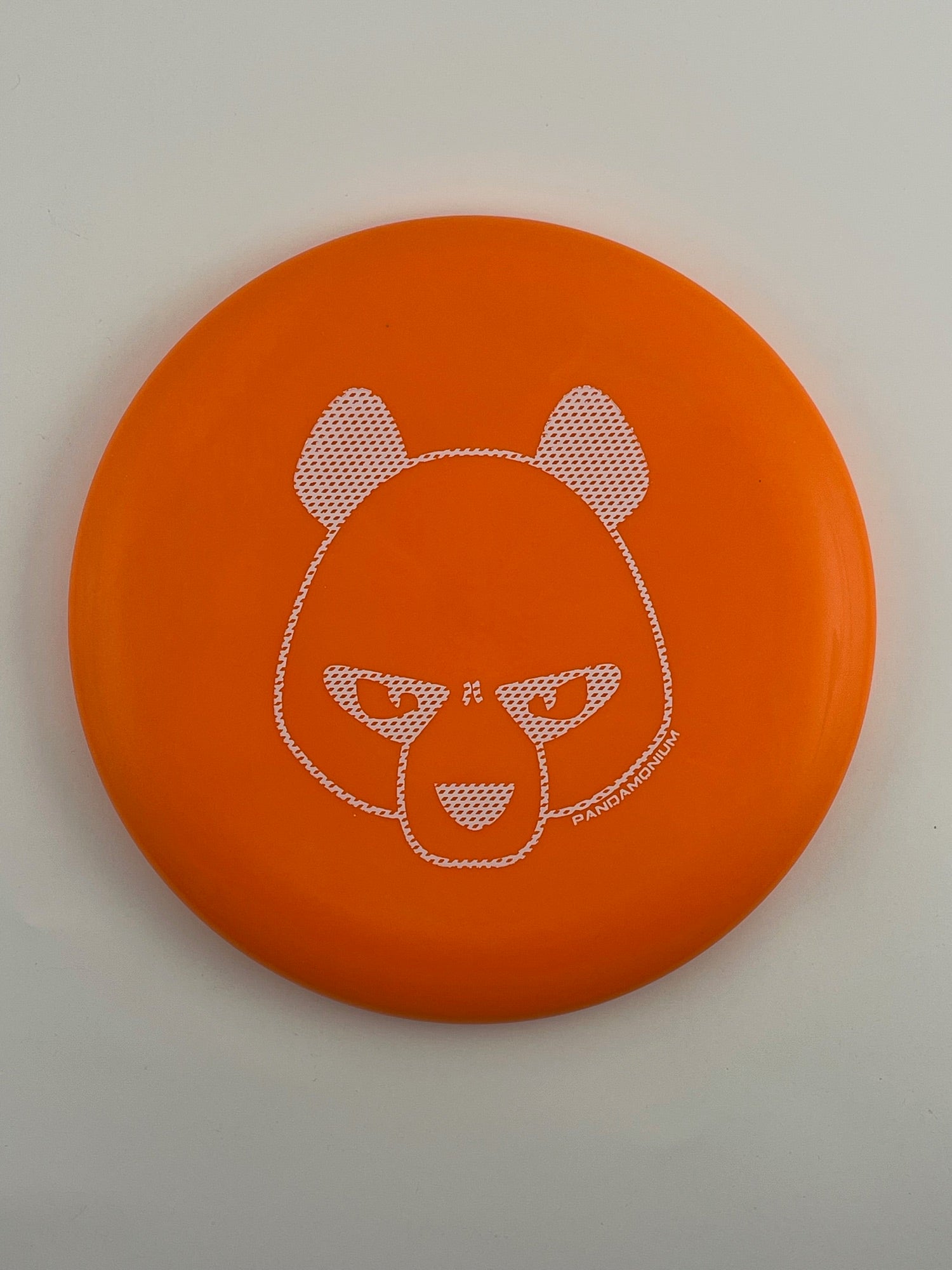 Innova JK Aviar disc golf putt and approach in orange Pro plastic with Pandamonium Big Panda stamp