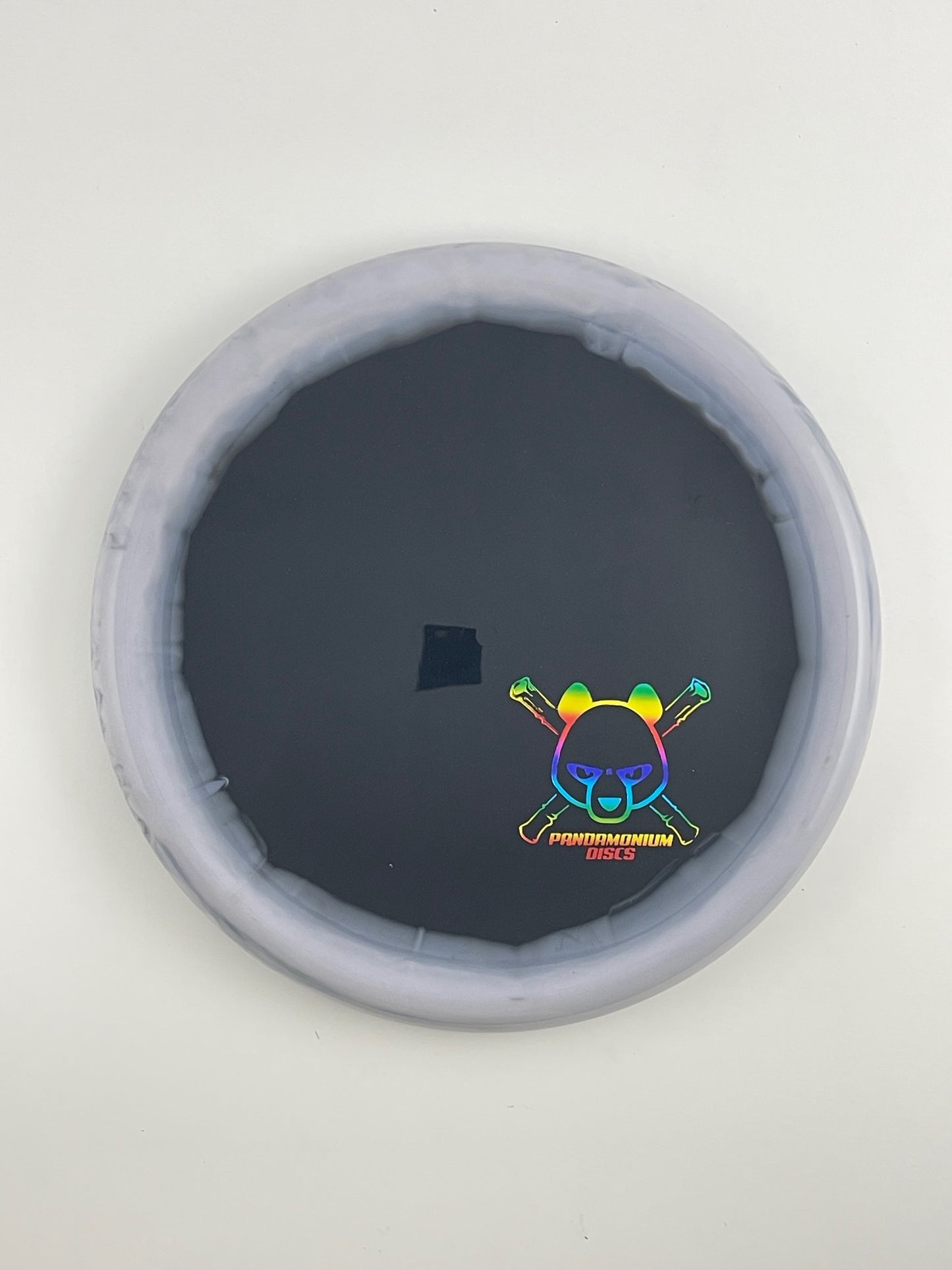 Kastaplast Berg disc golf putt and approach in graphite and black K1 Grind plastic with Pandamonium Panda Corner X stamp