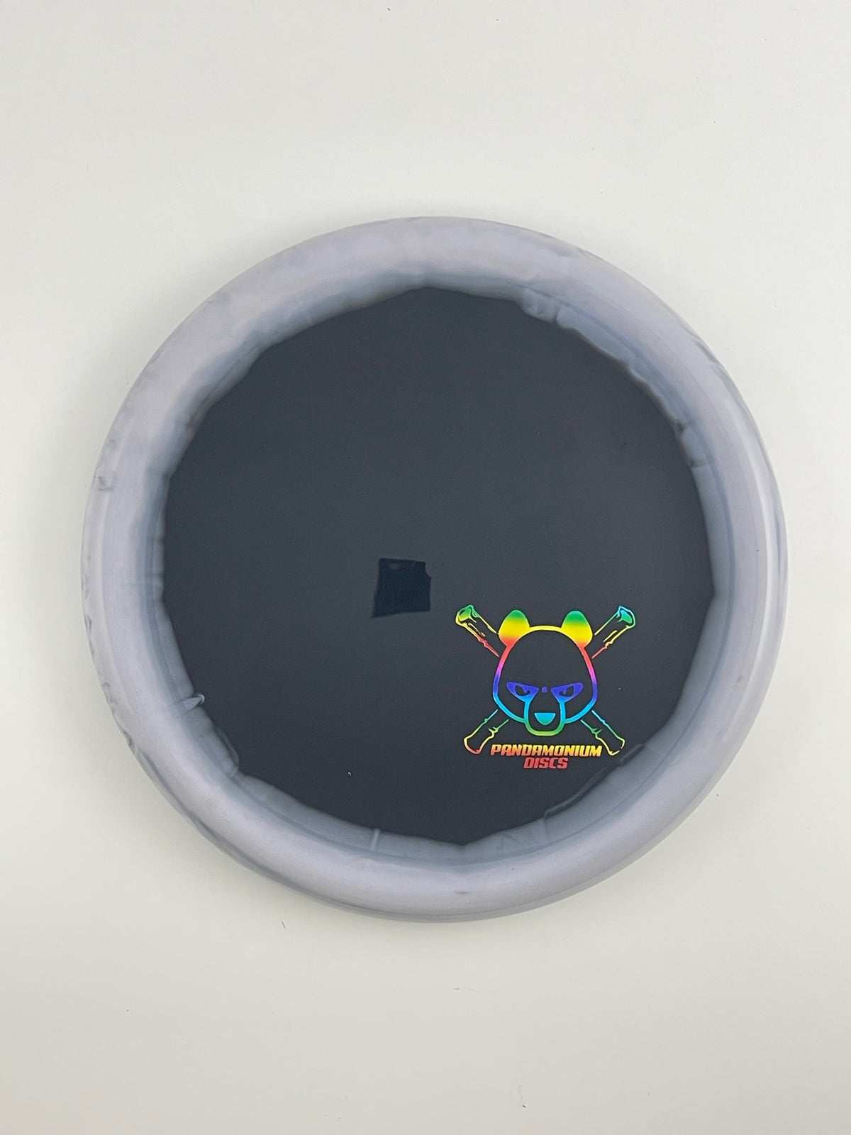 Kastaplast Berg disc golf putt and approach in graphite and black K1 Grind plastic with Pandamonium Panda Corner X stamp