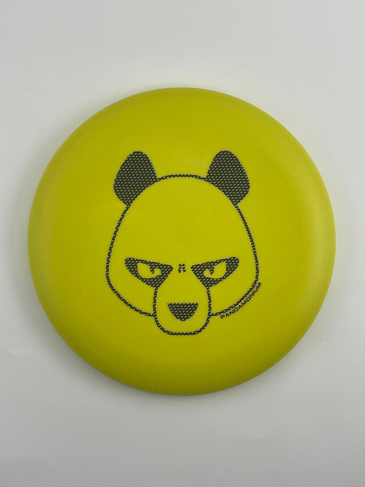 Innova KC Aviar disc golf putt and approach in yellow Pro plastic with Pandamonium Big Panda stamp