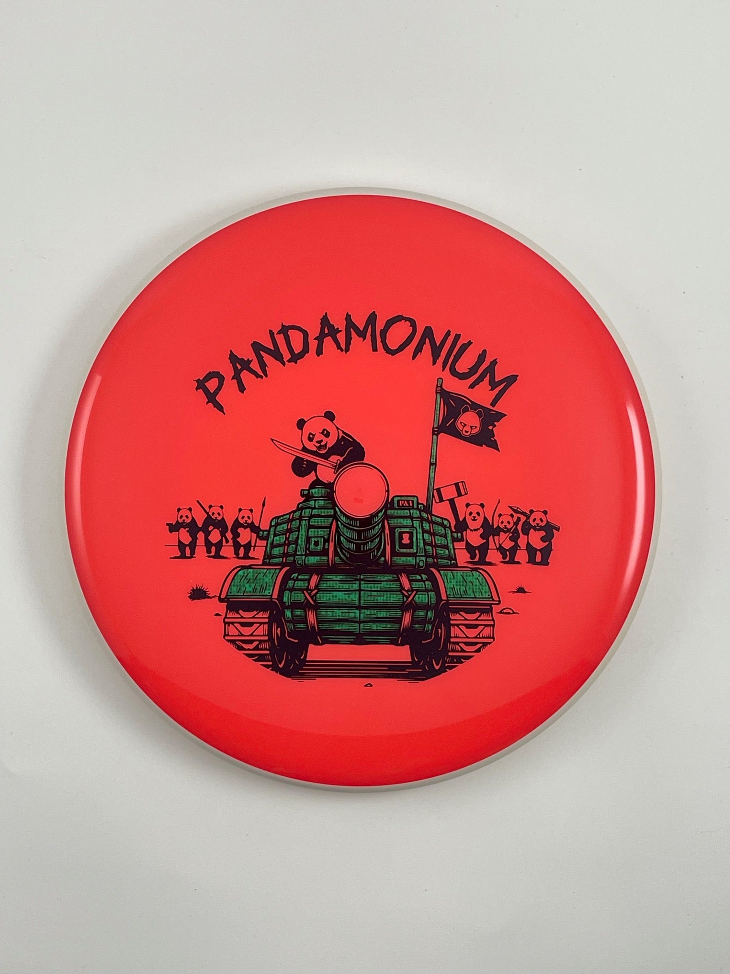MVP Glitch disc golf putt and approach in coral Neutron plastic with Pandamonium Panda Tank stamp