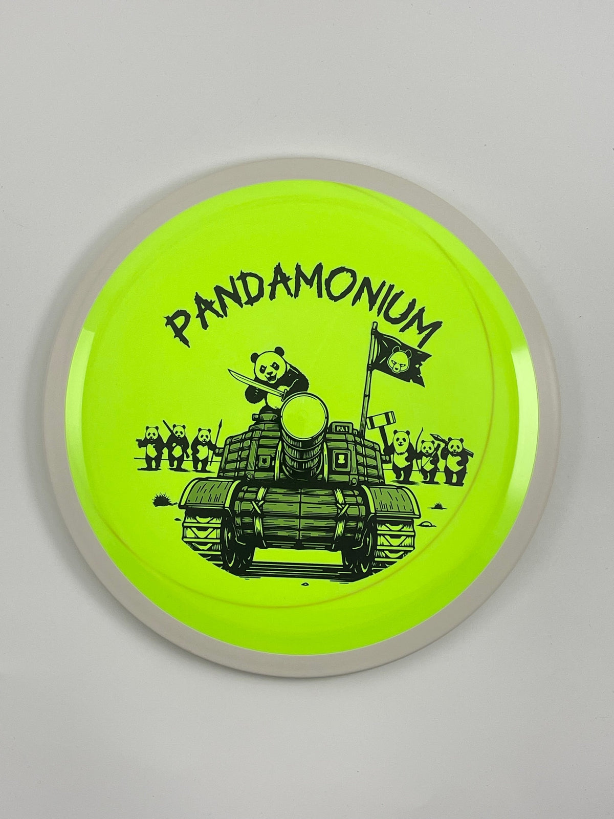 MVP Trail disc golf distance driver in highlighter and green Neutron plastic with Pandamonium Panda Tank stamp