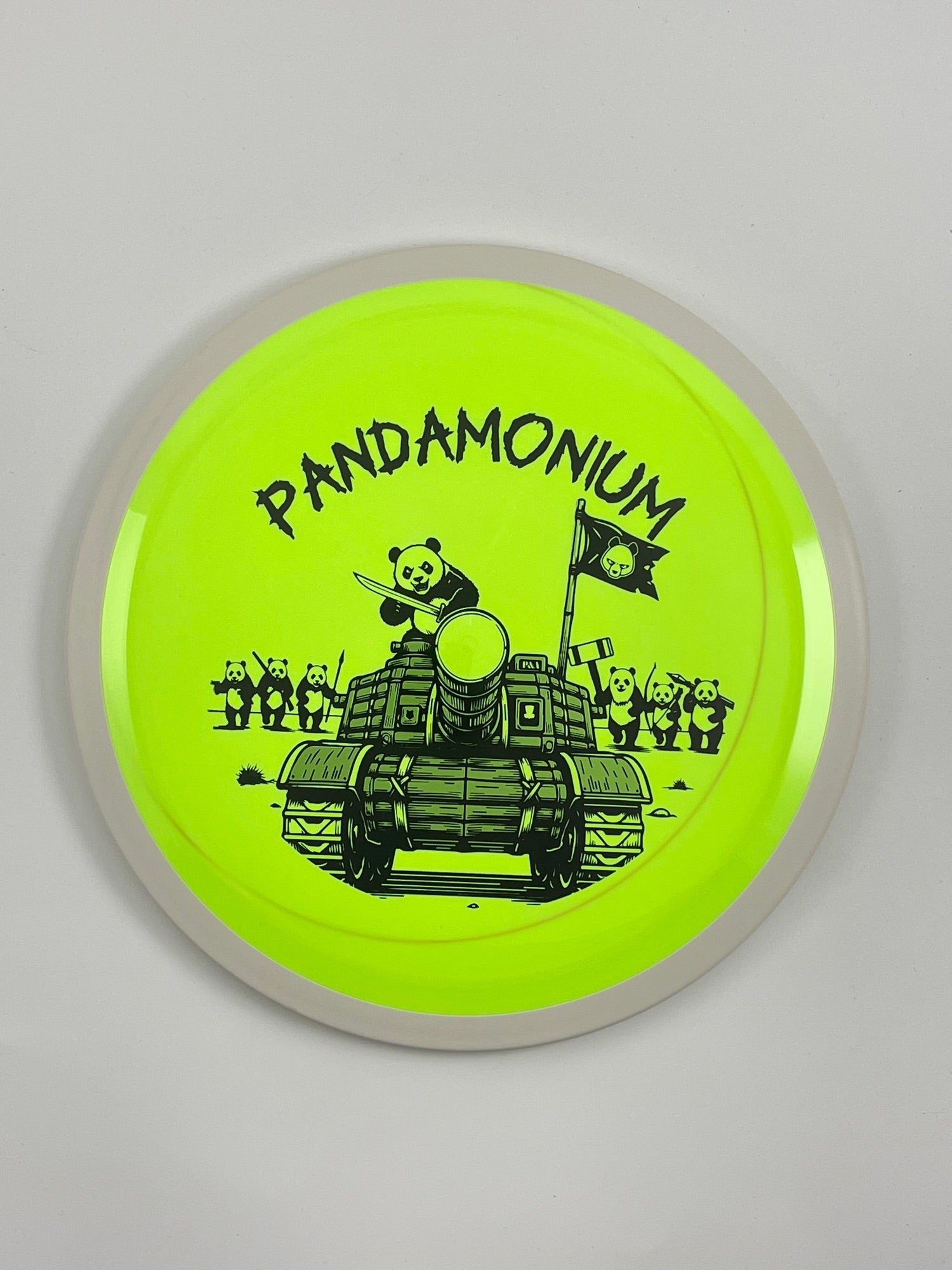 MVP Trail disc golf distance driver in highlighter and green Neutron plastic with Pandamonium Panda Tank stamp