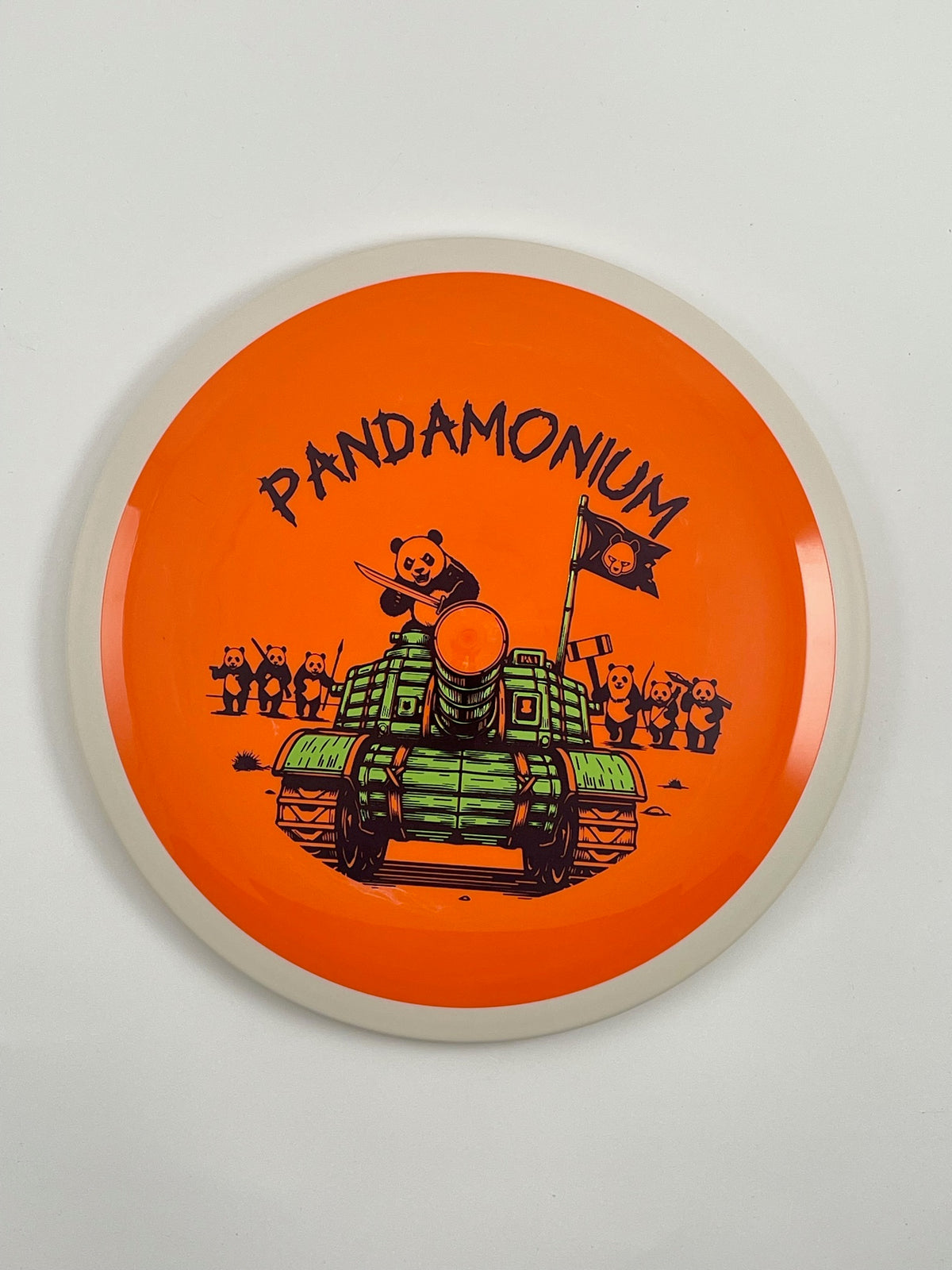 MVP Trail disc golf distance driver in orange Neutron plastic with Pandamonium Panda Tank stamp