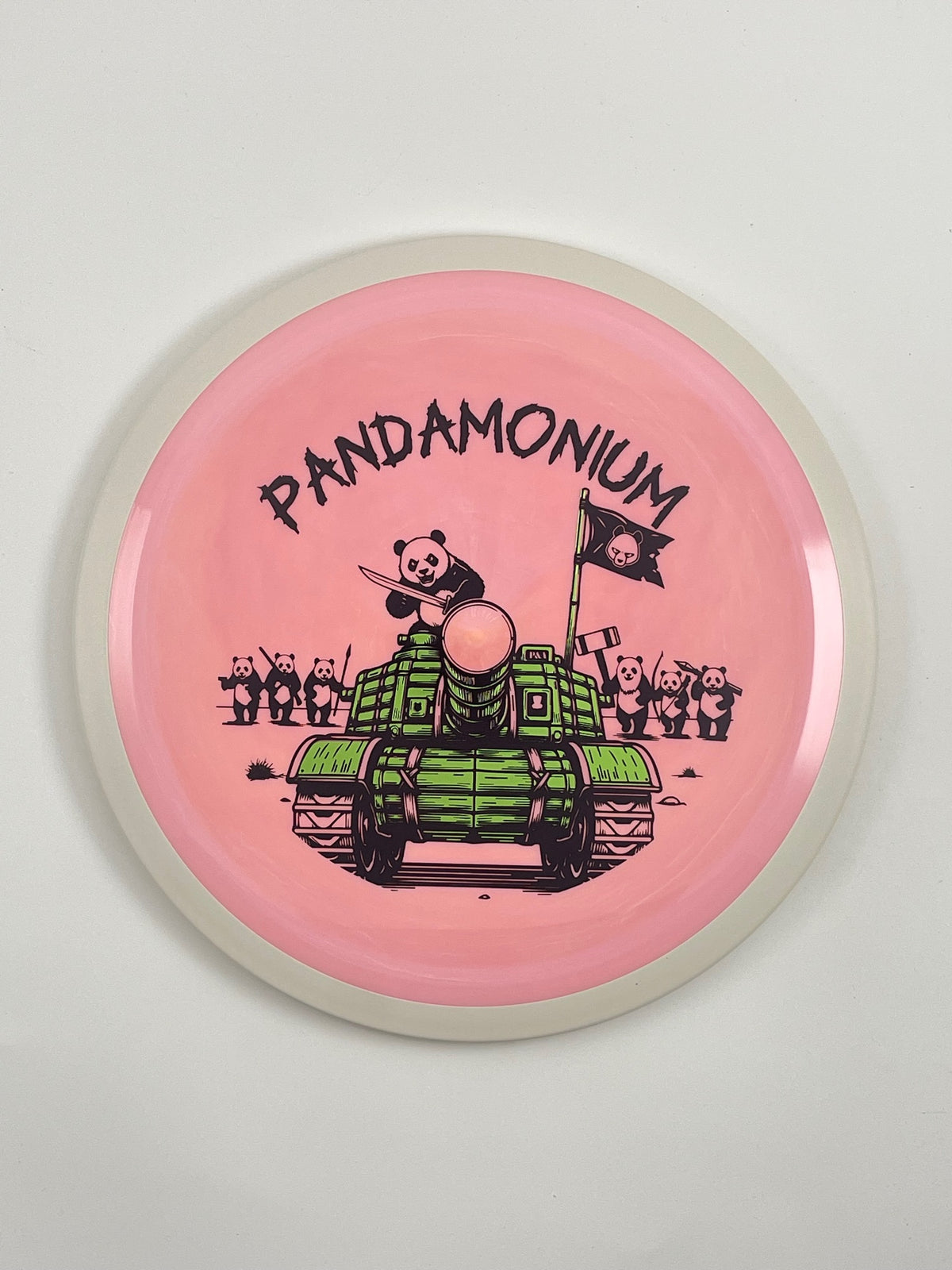 MVP Trail disc golf distance driver in pink Neutron plastic with Pandamonium Panda Tank stamp