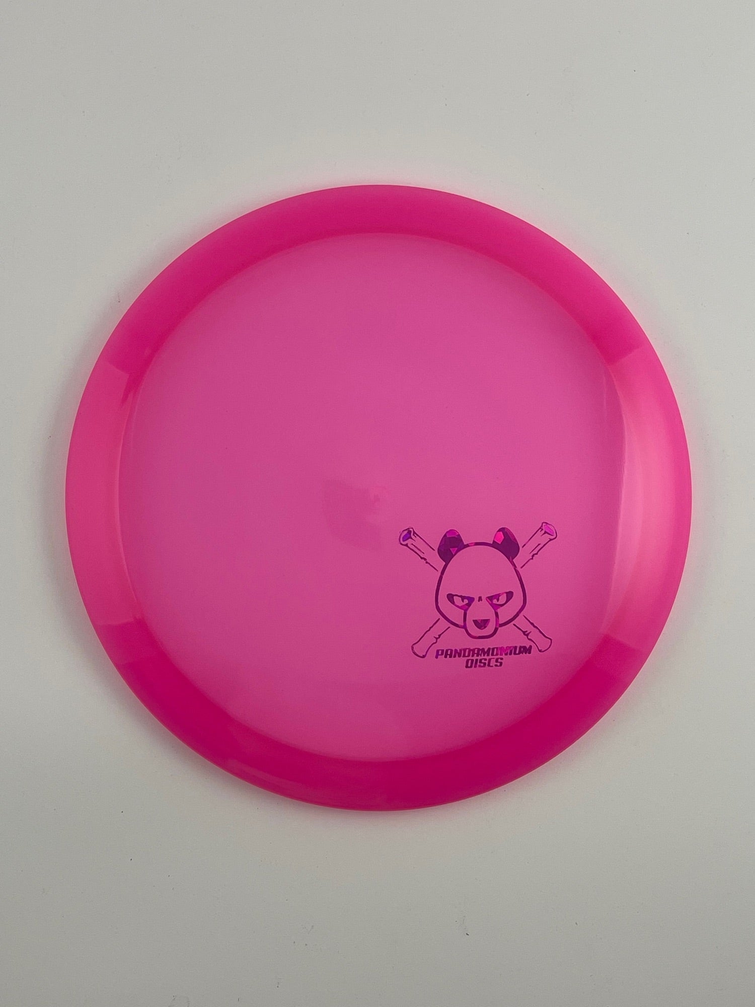 Latitude 64 River disc golf fairway driver in pink Opto plastic with Pandamonium Panda Corner X stamp
