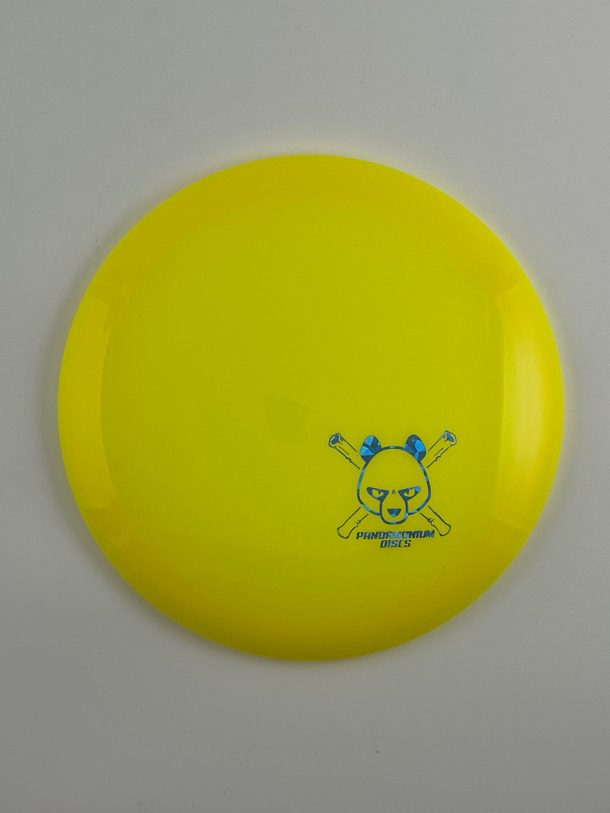 Latitude 64 River disc golf fairway driver in yellow Opto plastic with Pandamonium Panda Corner X stamp
