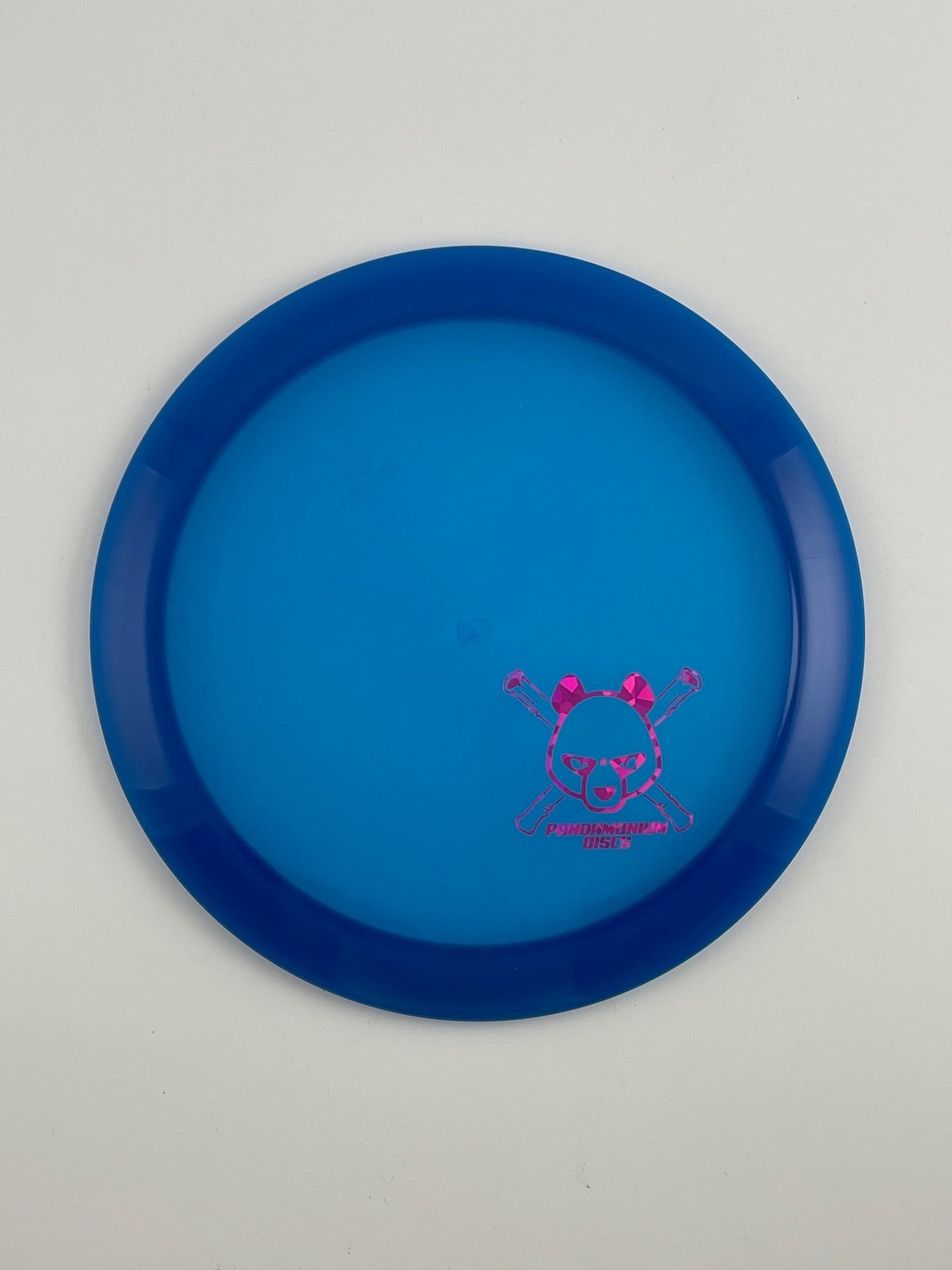 Latitude 64 Sapphire disc golf distance driver in blue Opto plastic with Pandamonium Panda Corner X stamp