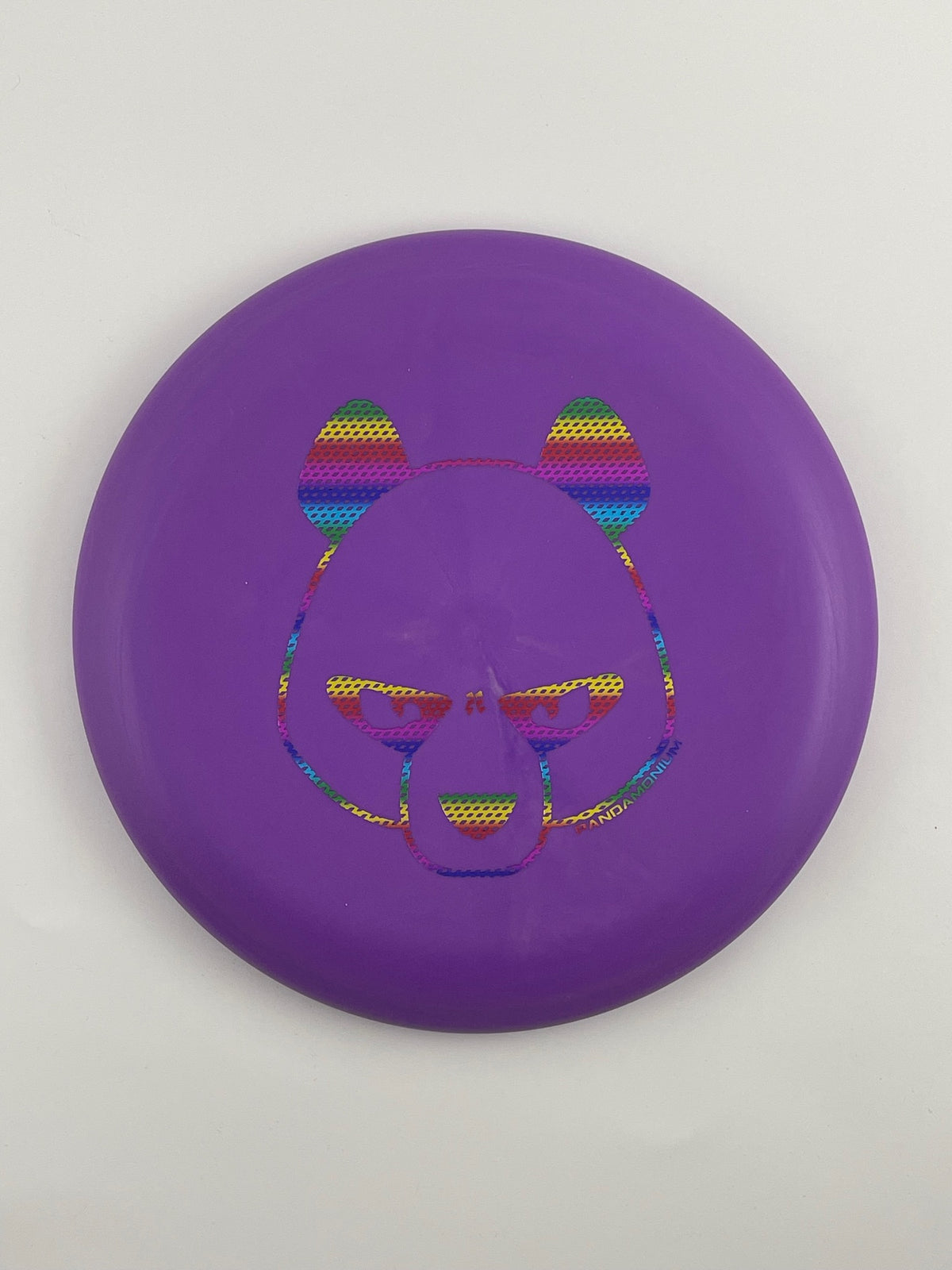 Innova Pig disc golf putt and approach in purple R-Pro plastic with Pandamonium Big Panda stamp