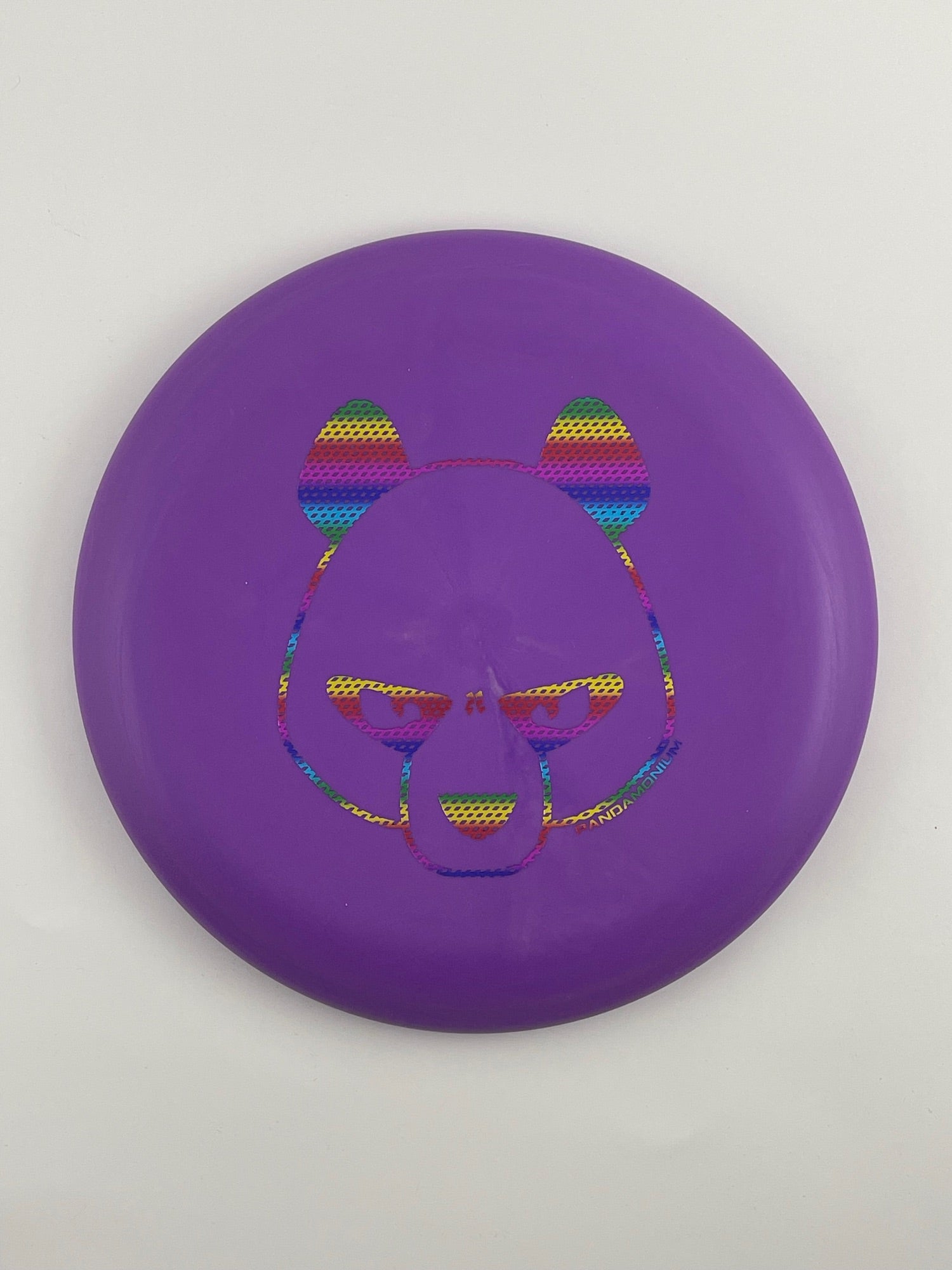 Innova Pig disc golf putt and approach in purple R-Pro plastic with Pandamonium Big Panda stamp