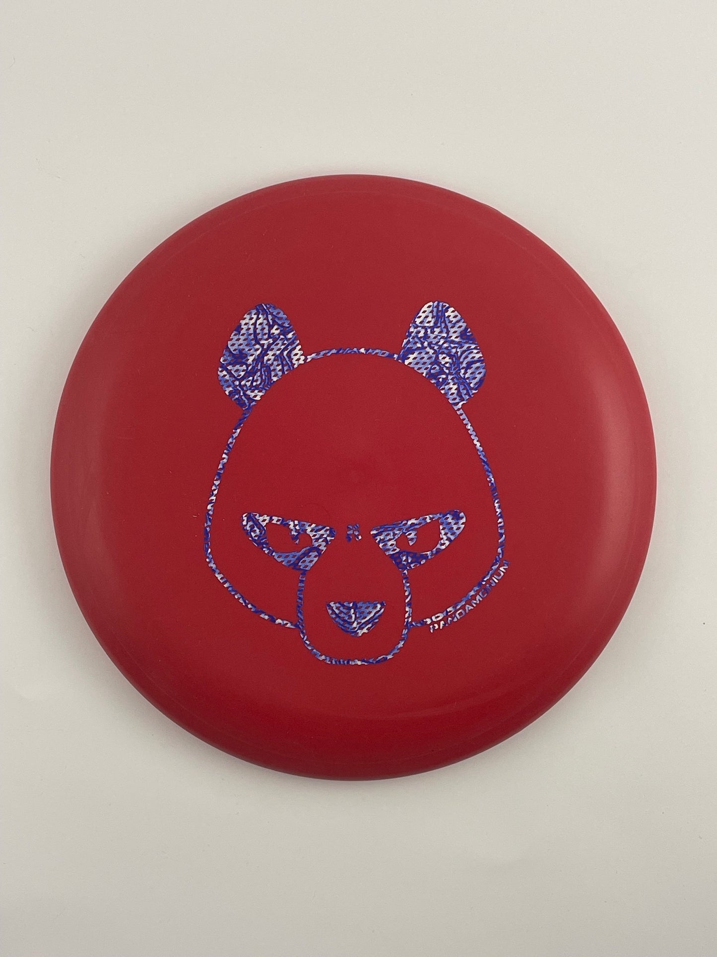 Innova Aviar disc golf putt and approach in red R-Pro plastic with Pandamonium Big Panda stamp