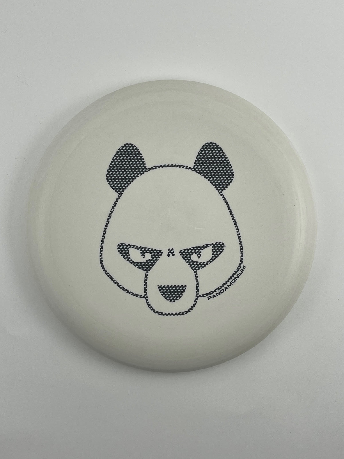 Innova Pig disc golf putt and approach in white R-Pro plastic with Pandamonium Big Panda stamp, view 2