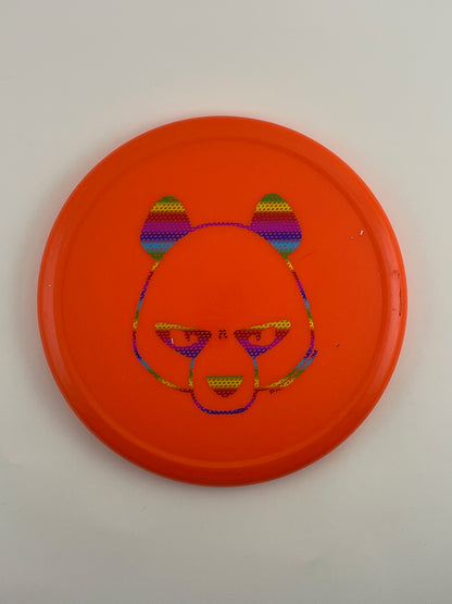 Innova Pig disc golf putt and approach in orange R-Pro plastic with Pandamonium Big Panda stamp, view 1