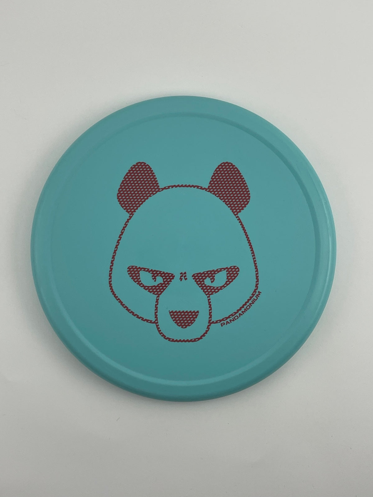 Innova Pig disc golf putt and approach in robin egg blue R-Pro plastic with Pandamonium Big Panda stamp, view 1