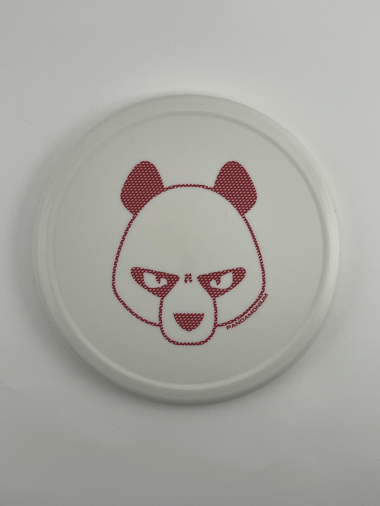 Innova Pig disc golf putt and approach in white R-Pro plastic with Pandamonium Big Panda stamp, view 1