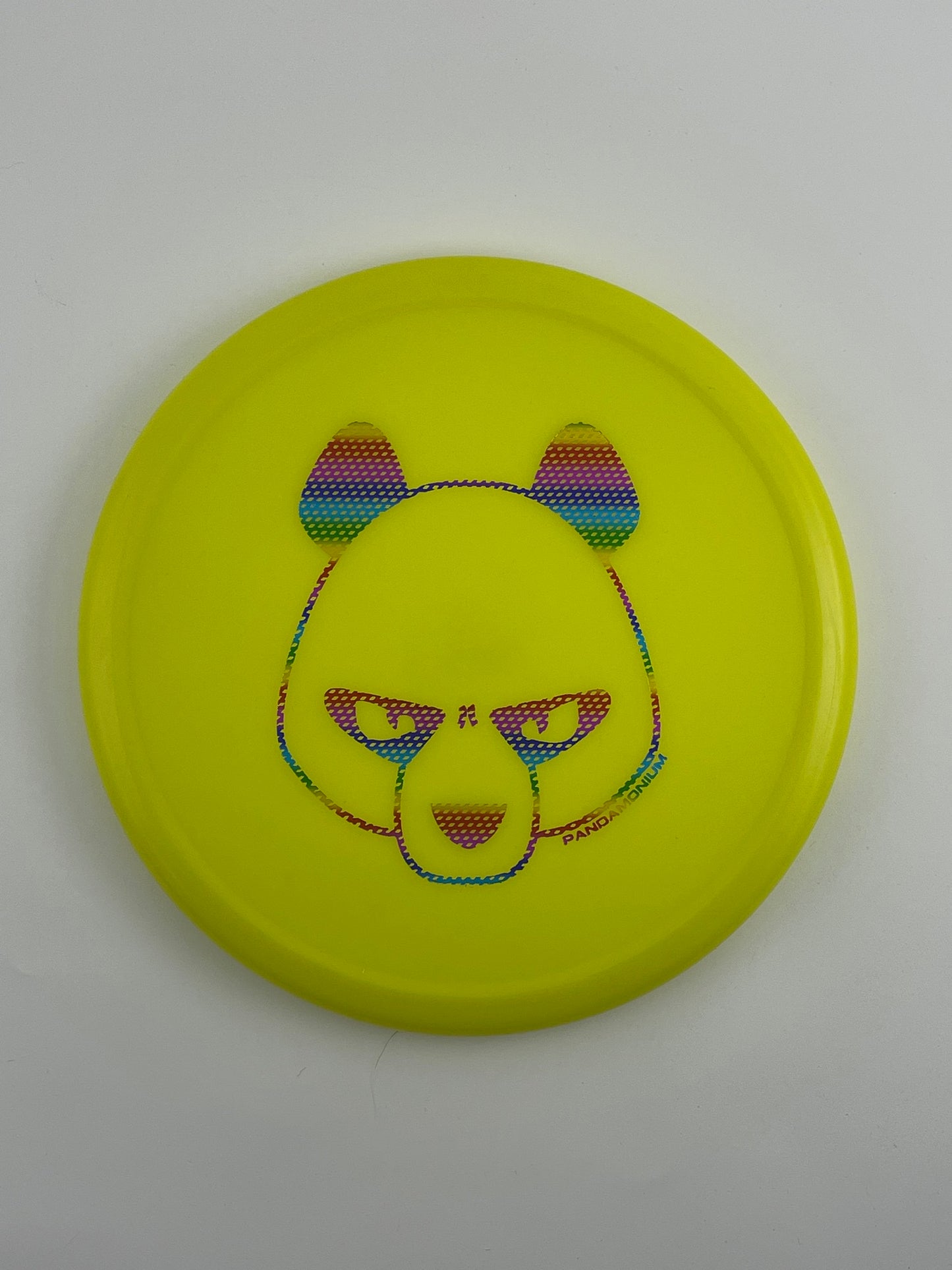 Innova Pig disc golf putt and approach in yellow R-Pro plastic with Pandamonium Big Panda stamp