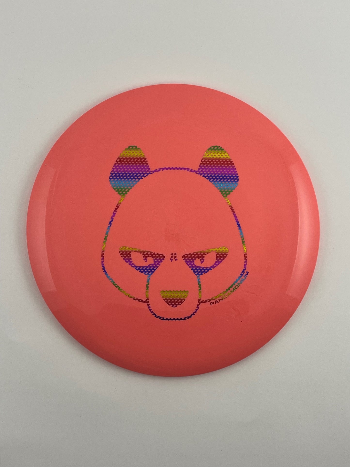 Innova Destroyer disc golf distance driver in coral Star plastic with Pandamonium Big Panda stamp