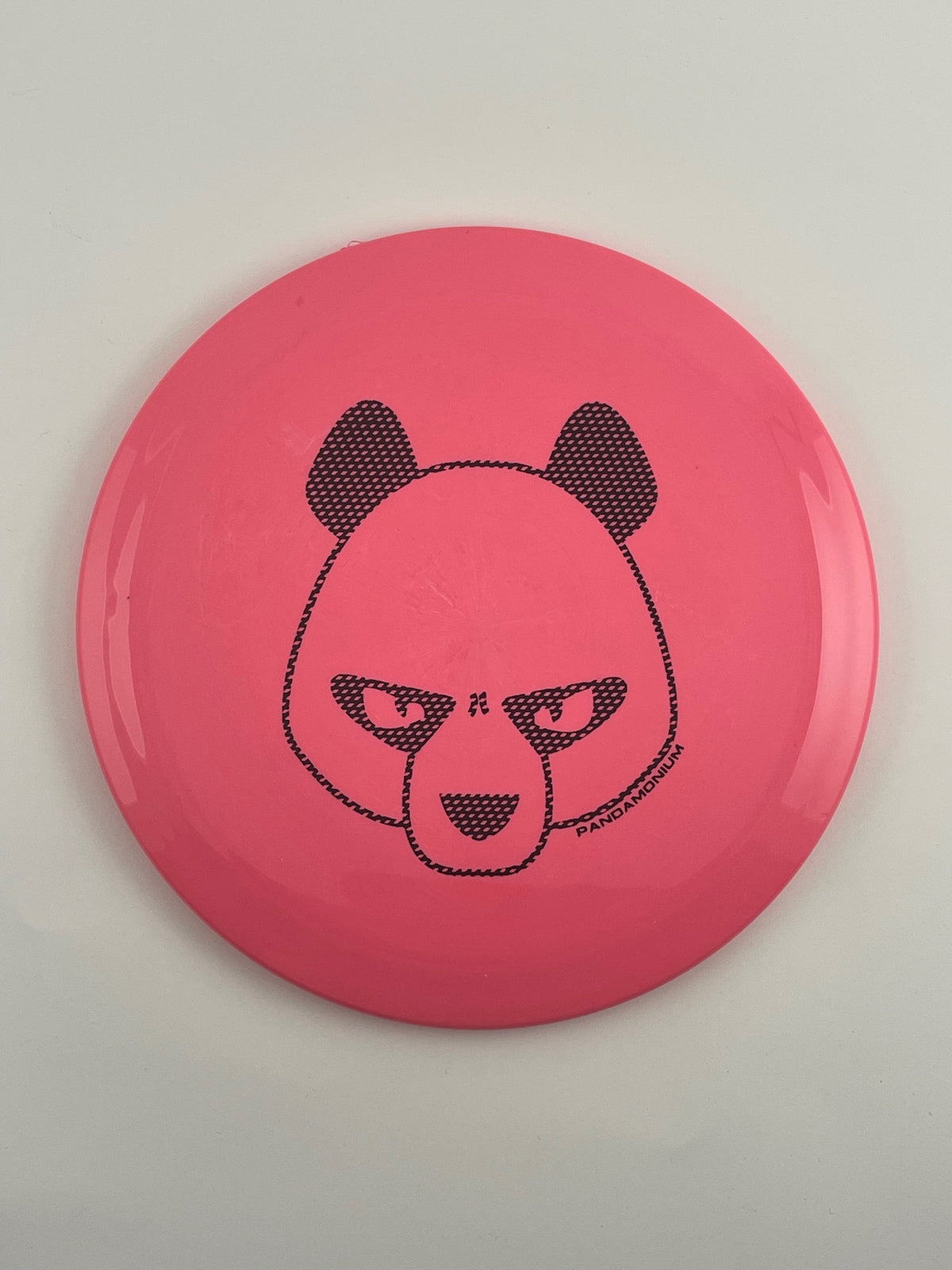 Innova Firebird disc golf fairway driver in pink Star plastic with Pandamonium Big Panda stamp