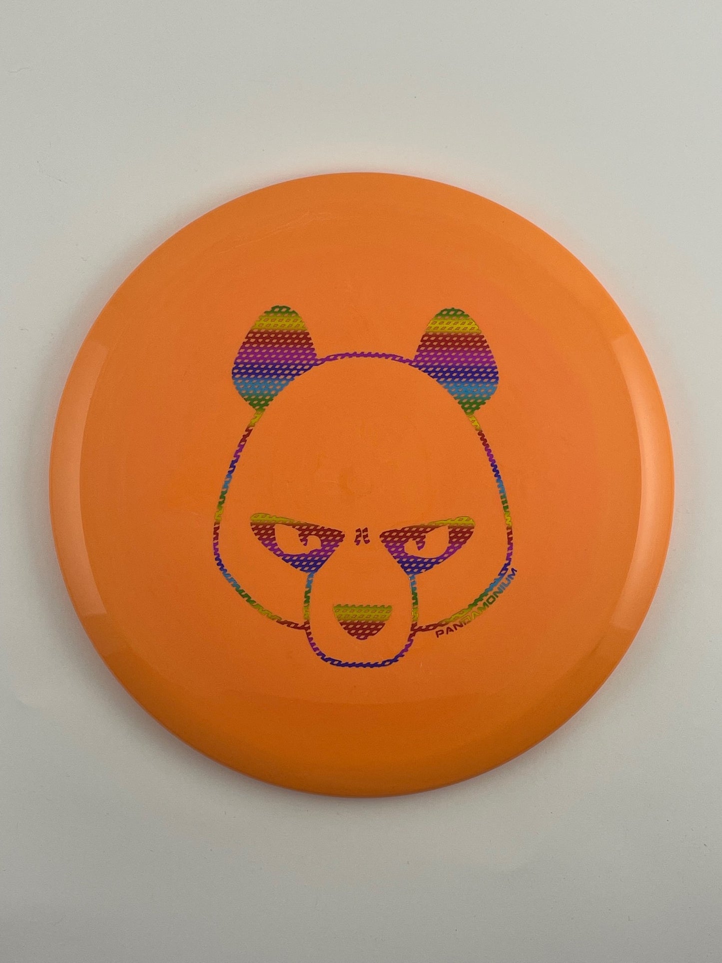 Innova Fox disc golf midrange in orange Star plastic with Pandamonium Big Panda stamp