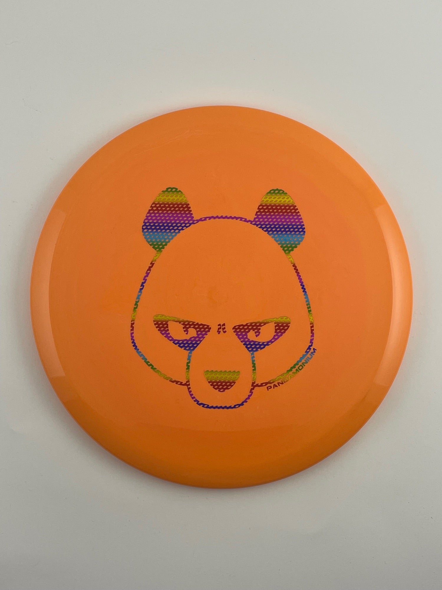 Innova Fox disc golf midrange in orange Star plastic with Pandamonium Big Panda stamp