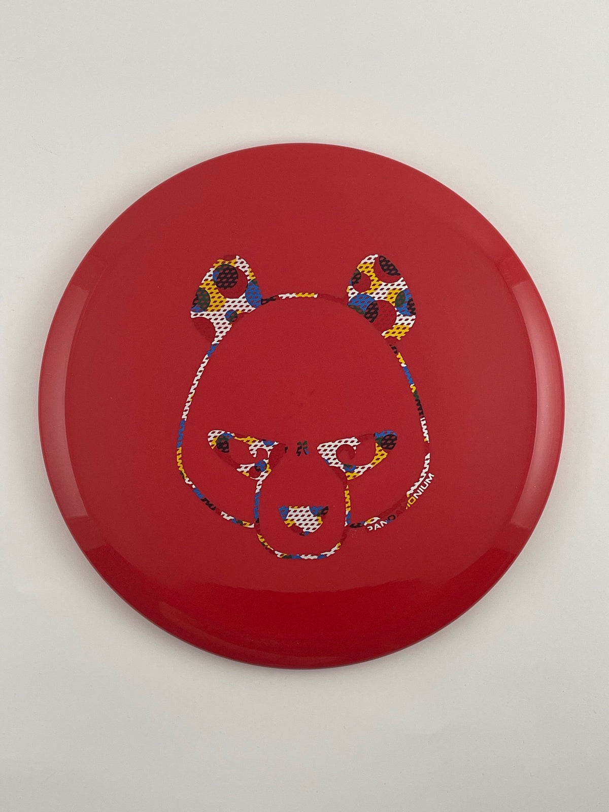 Innova Fox disc golf midrange in red Star plastic with Pandamonium Big Panda stamp