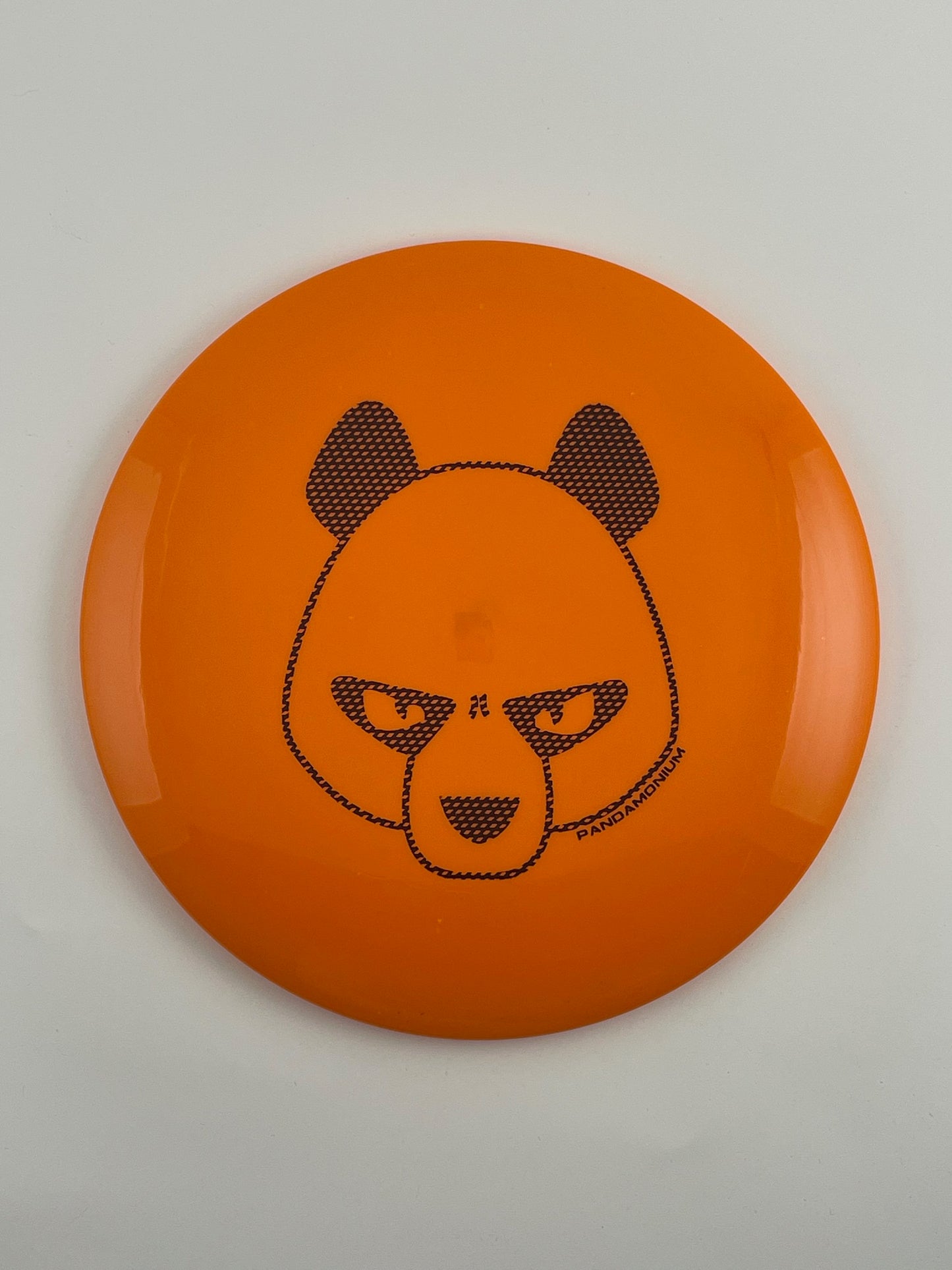 Innova Leopard disc golf fairway driver in orange Star plastic with Pandamonium Big Panda stamp